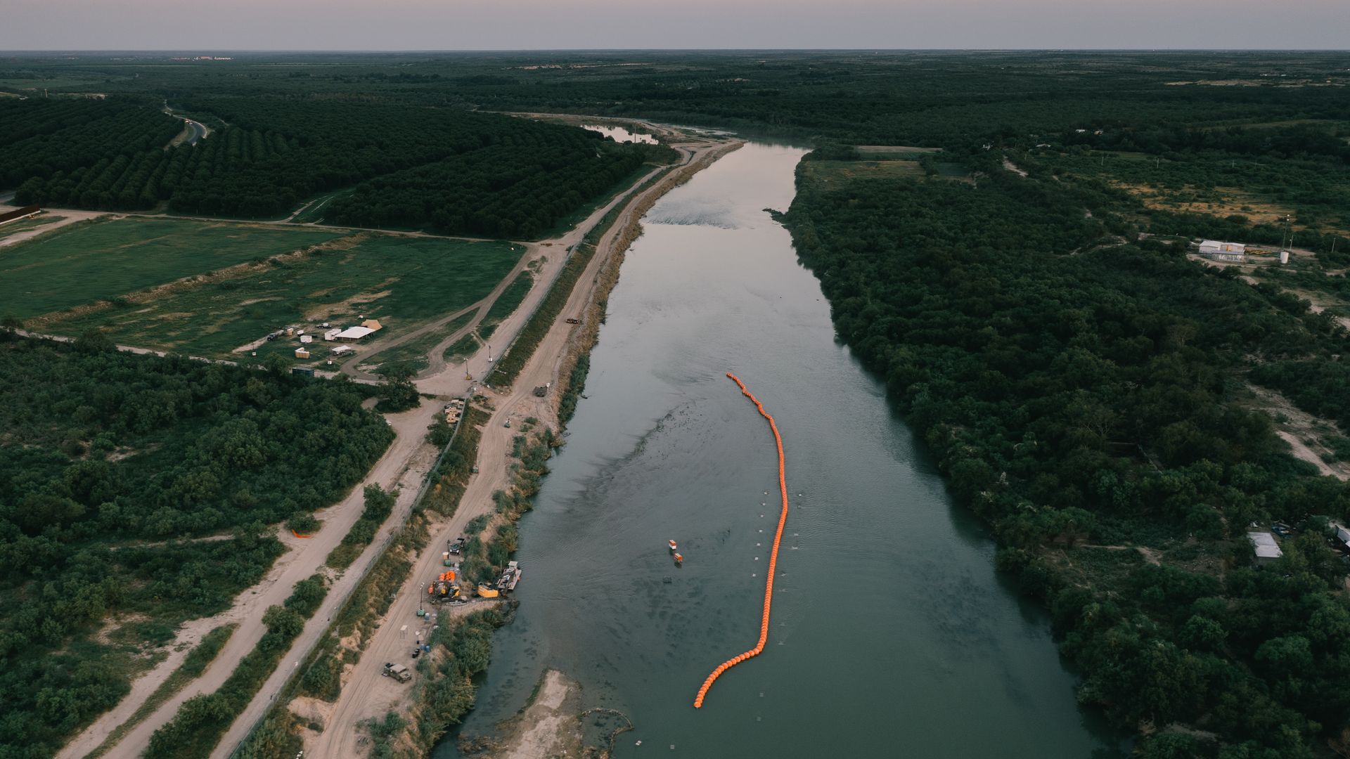 A string of buoys used as a border barrier on the Rio Grande River in Eagle Pass, Texas, US, on Thursday, July 13, 2023. Texas started deploying a new floating barrier on the Rio Grande as a way to deter migrant crossings at the US-Mexico border.