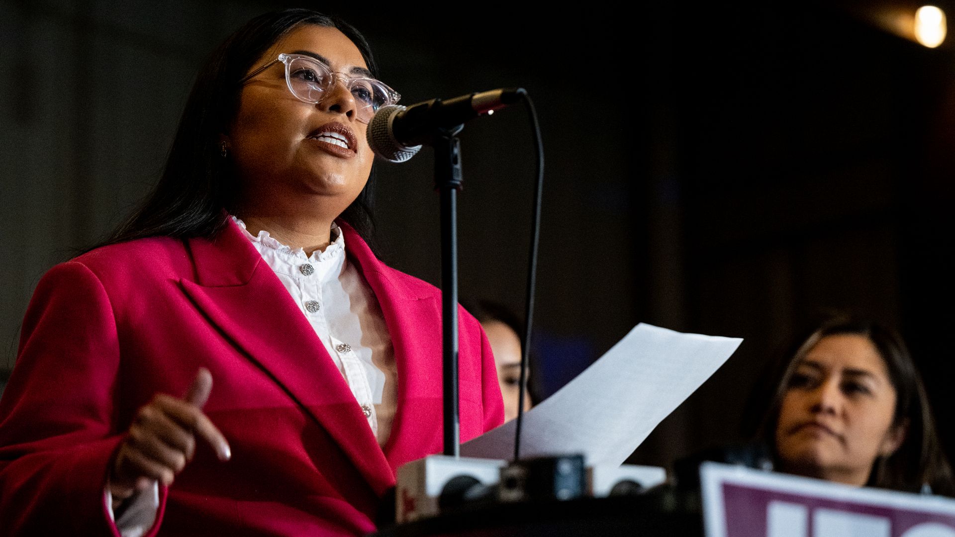 U.S. House candidate Jessica Cisneros of south Texas speaks in front of a microphone in March 2022