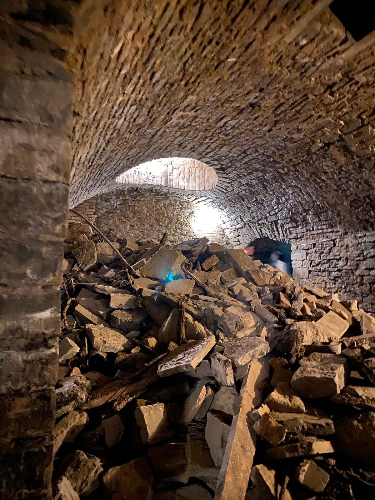 Something spooky lurking in the Linck tunnels near Findlay Market? Take a closer look at the archway beyond the rubble. Photos: Courtesy of American Legacy Tours