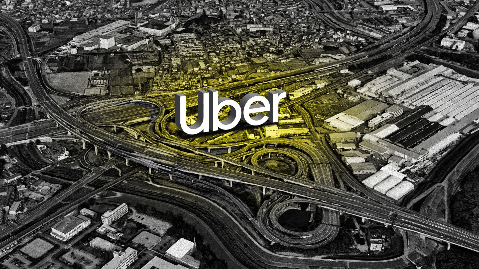 An Uber logo in the middle of a busy transport interchange