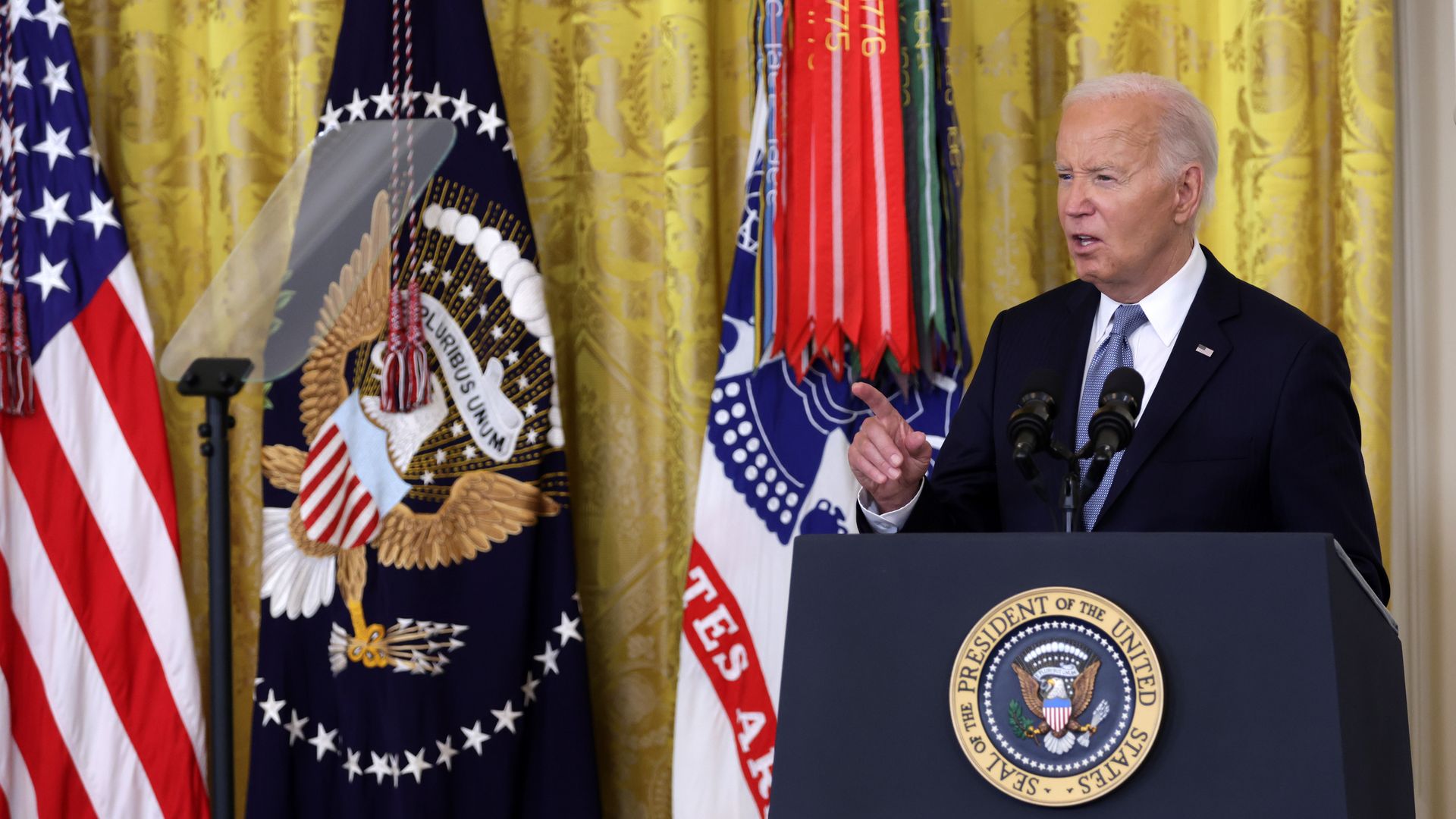 Biden reading from a teleprompter.