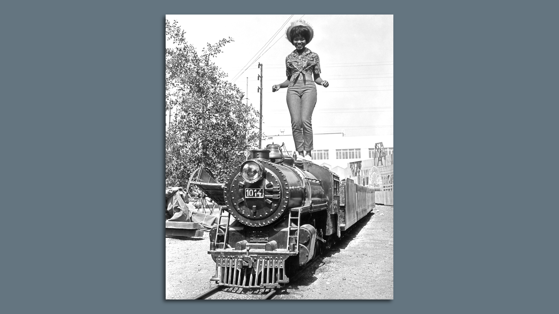 Little Eva (Eva Narcissus Boyd) poses on a miniature train for her album cover session in 1962. 