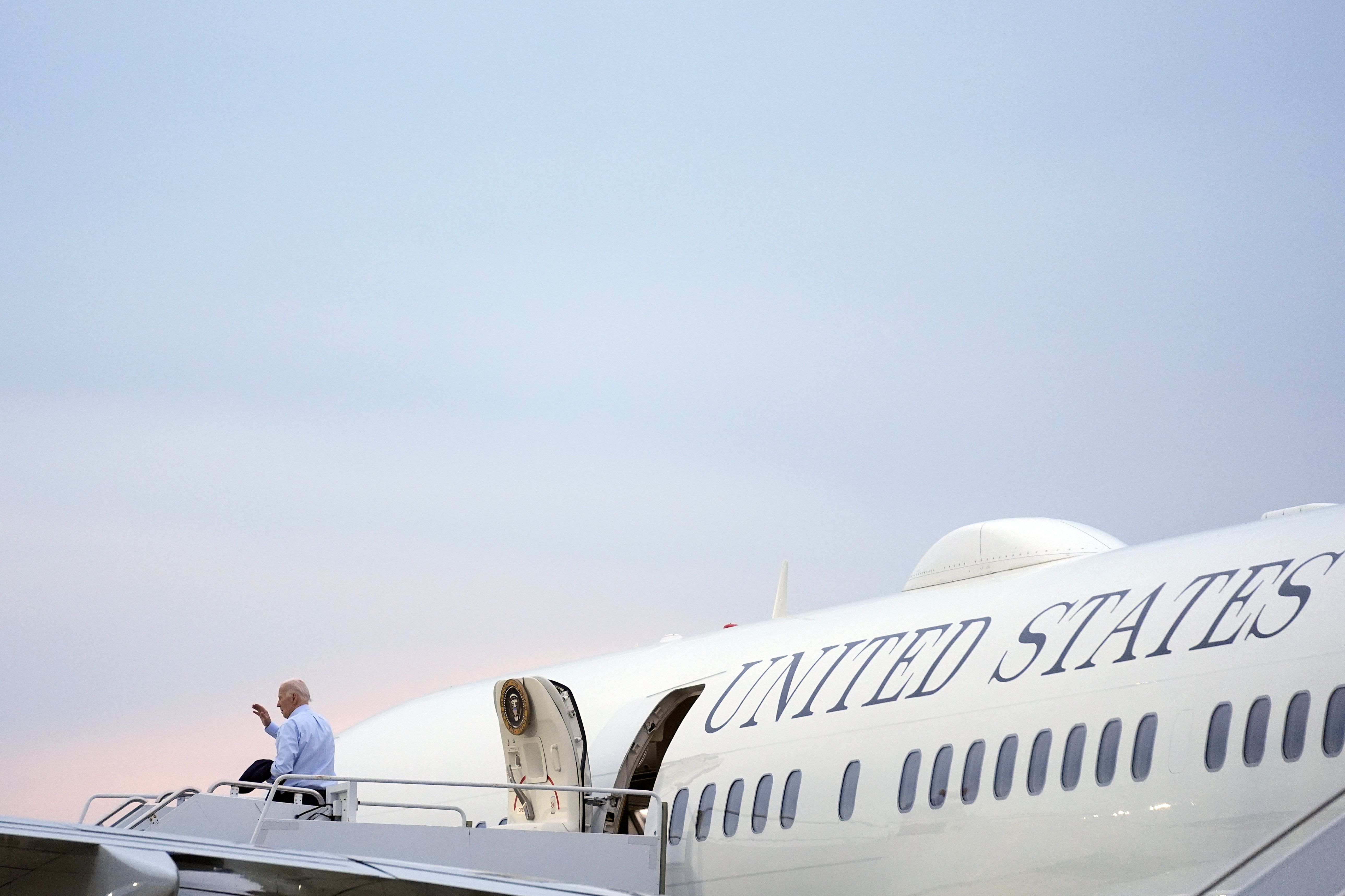 President Joe Biden boards Air Force One at Delaware Air National Guard Base in Wilmington yesterday.