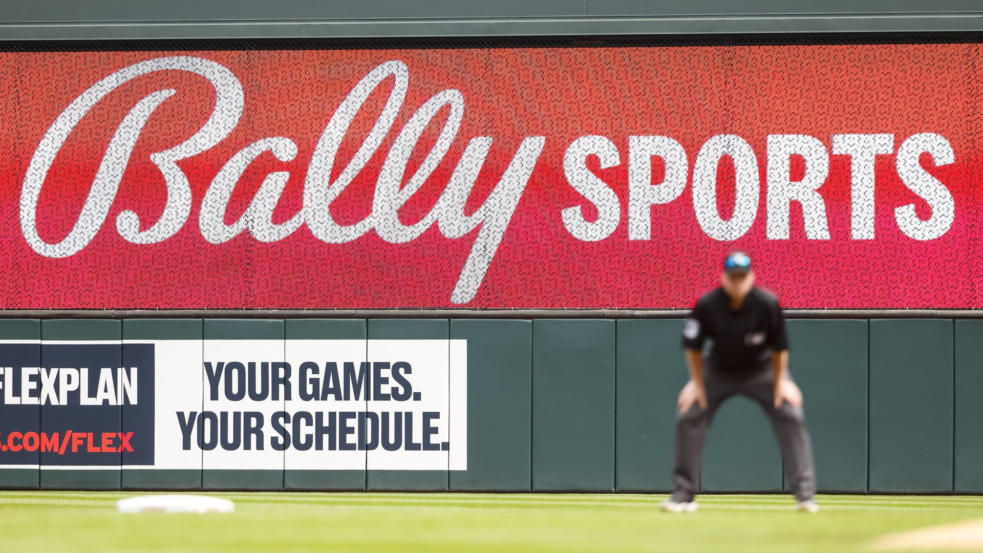 A Bally Sports sign on the wall at Target Field