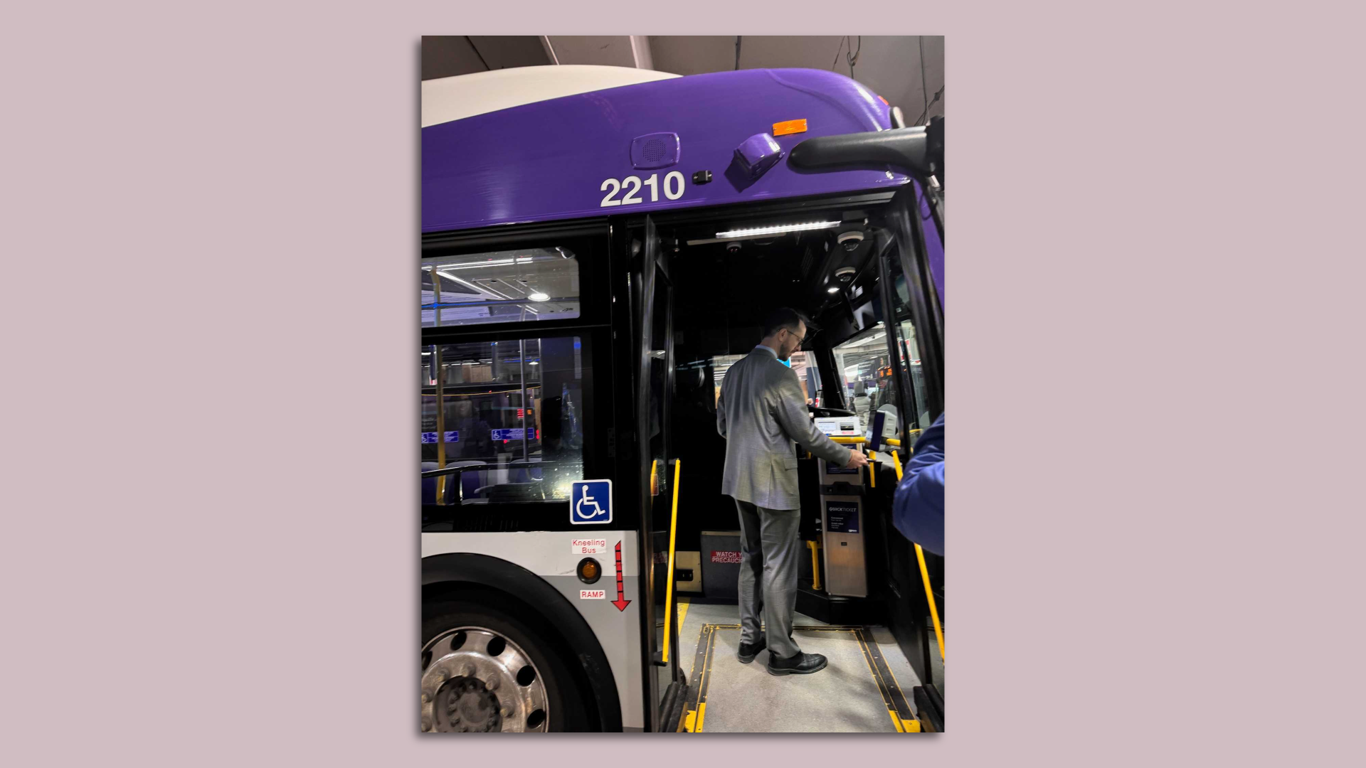 Mayor Freddie O'Connell boards a bus