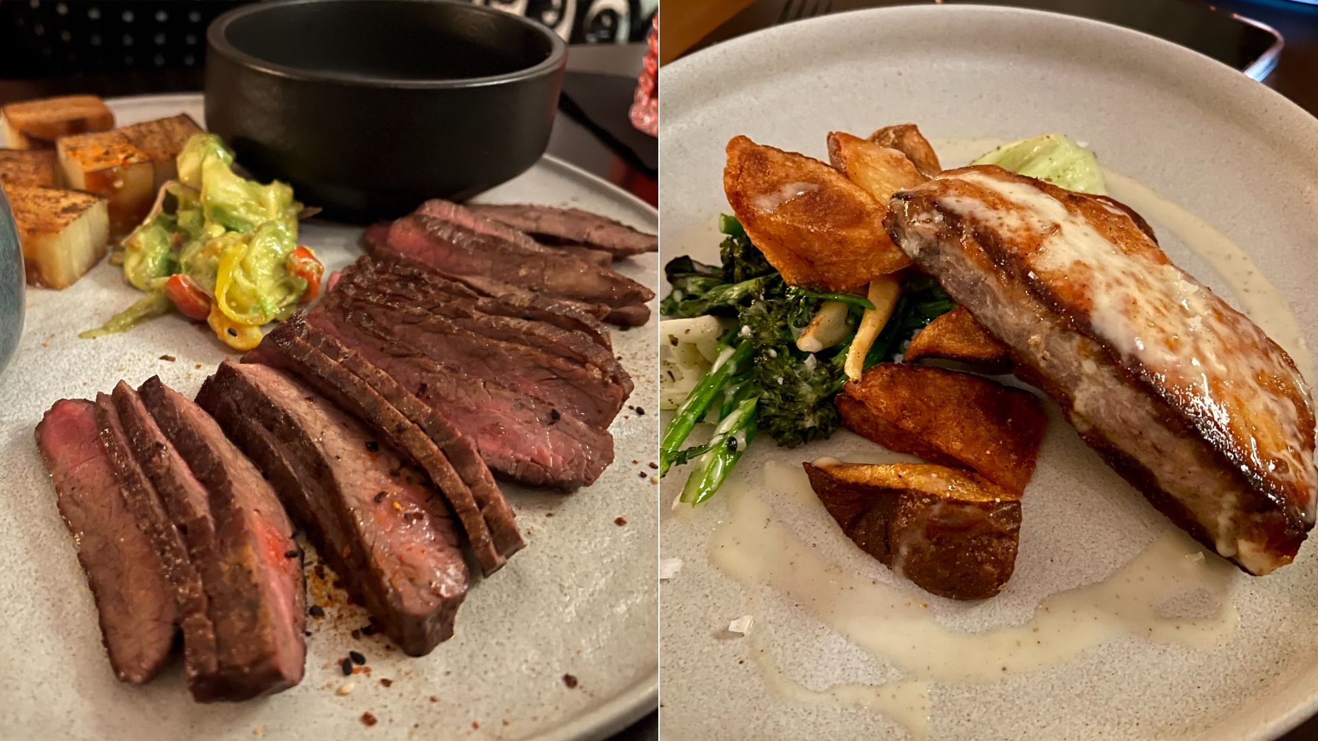 Two plates of food: the left has slices of medium-rare steak, grilled potatoes, and a vegetable salad; the right has grilled salmon with creamy sauce, roasted potatoes, and green vegetables.
