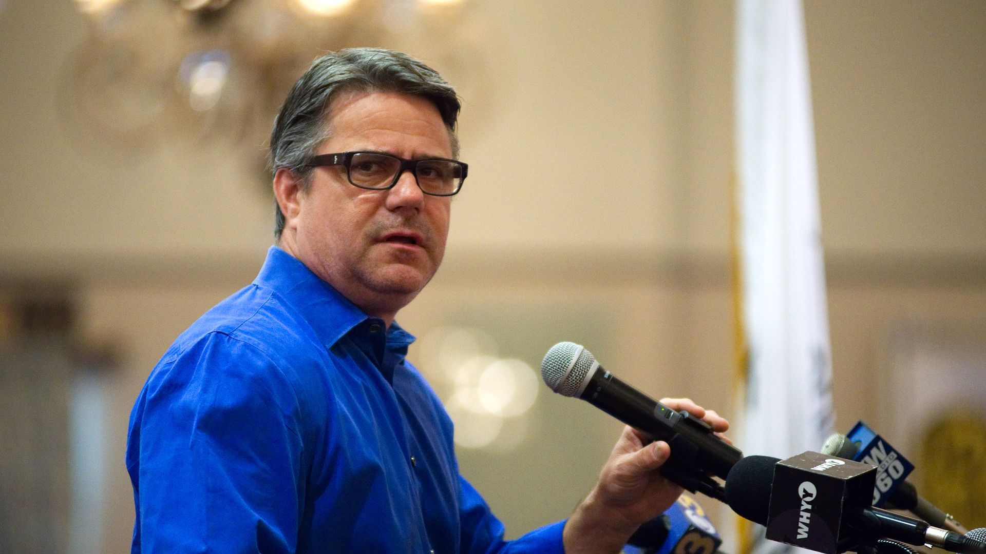 Philadelphia City Councilmember Bobby Henon speaks into a microphone.