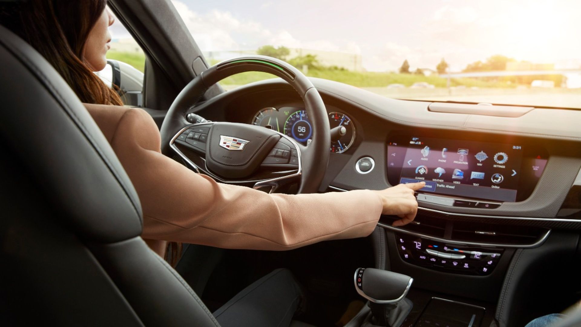 Image of woman operating Cadillac's Super Cruise hands-free highway driving system