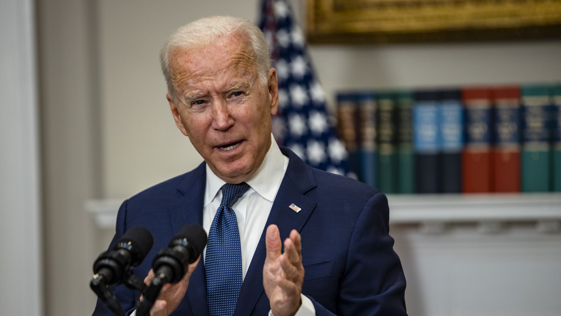 Biden speaking at podium