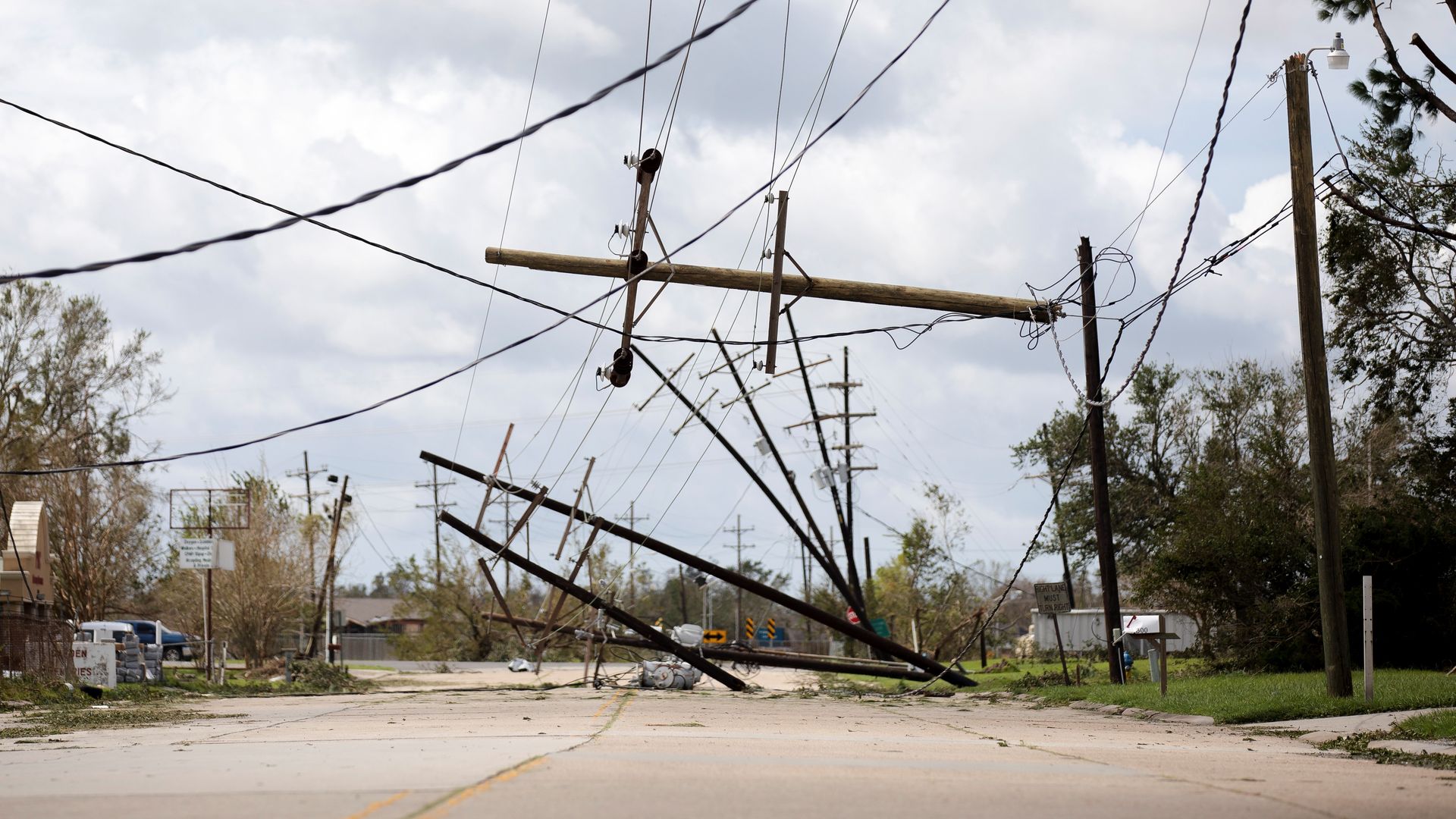 Power lines tipping over to the side after a hurricane.