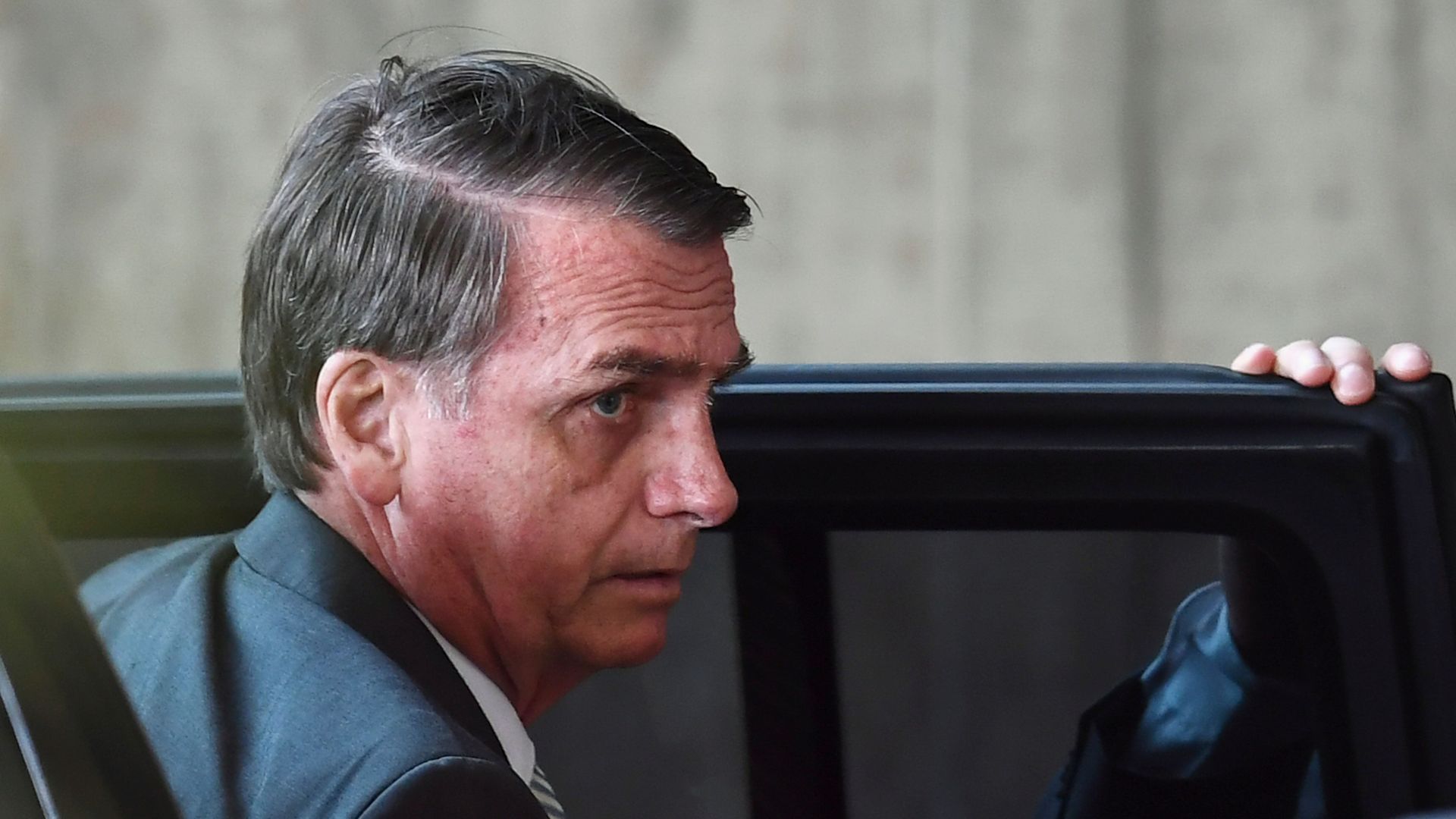 Brazilian President-elect Jair Bolsonaro arrives at the transitional government's headquarters in Brasilia, on November 27, 2018. - Bolsonaro takes office on January 1, 2019. 