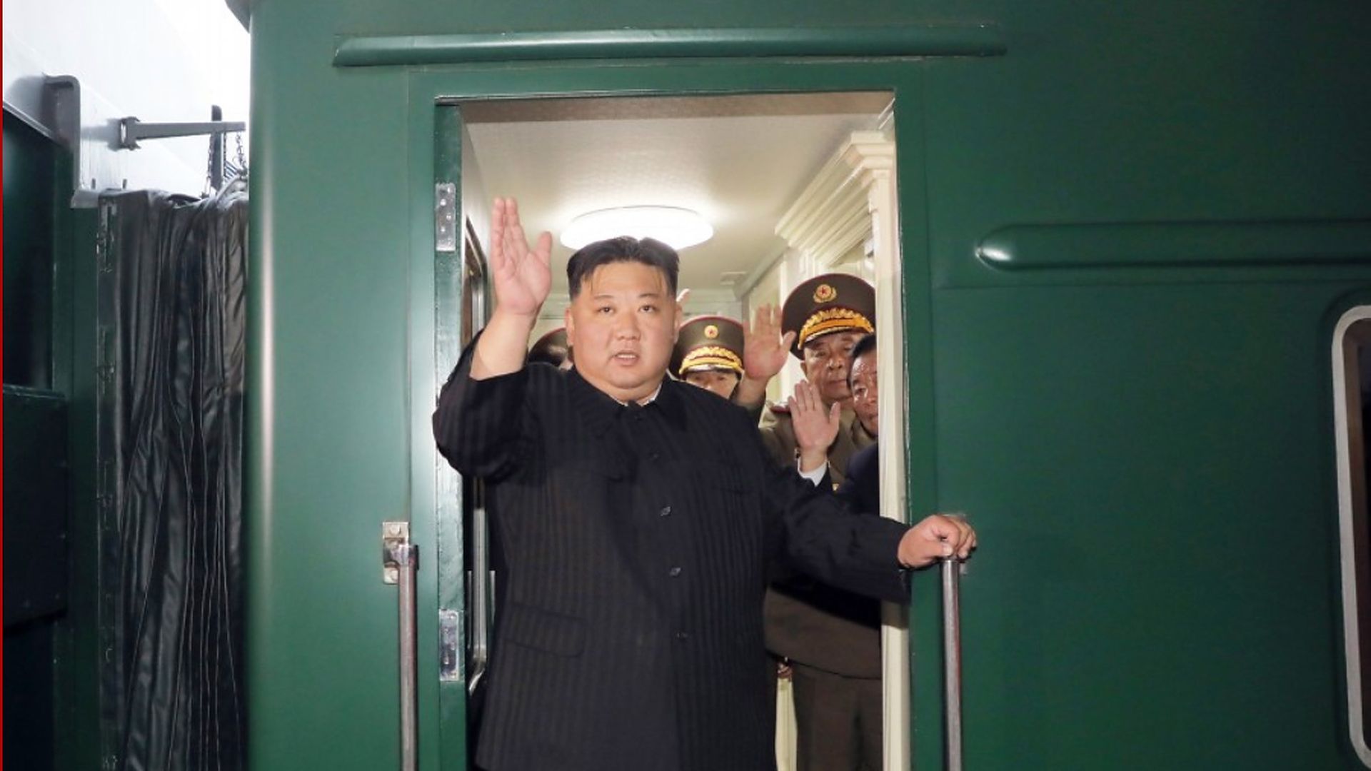North Korean leader Kim Jong-un and his generals wave goodbye on his armored train in Pyongyang, North Korea.