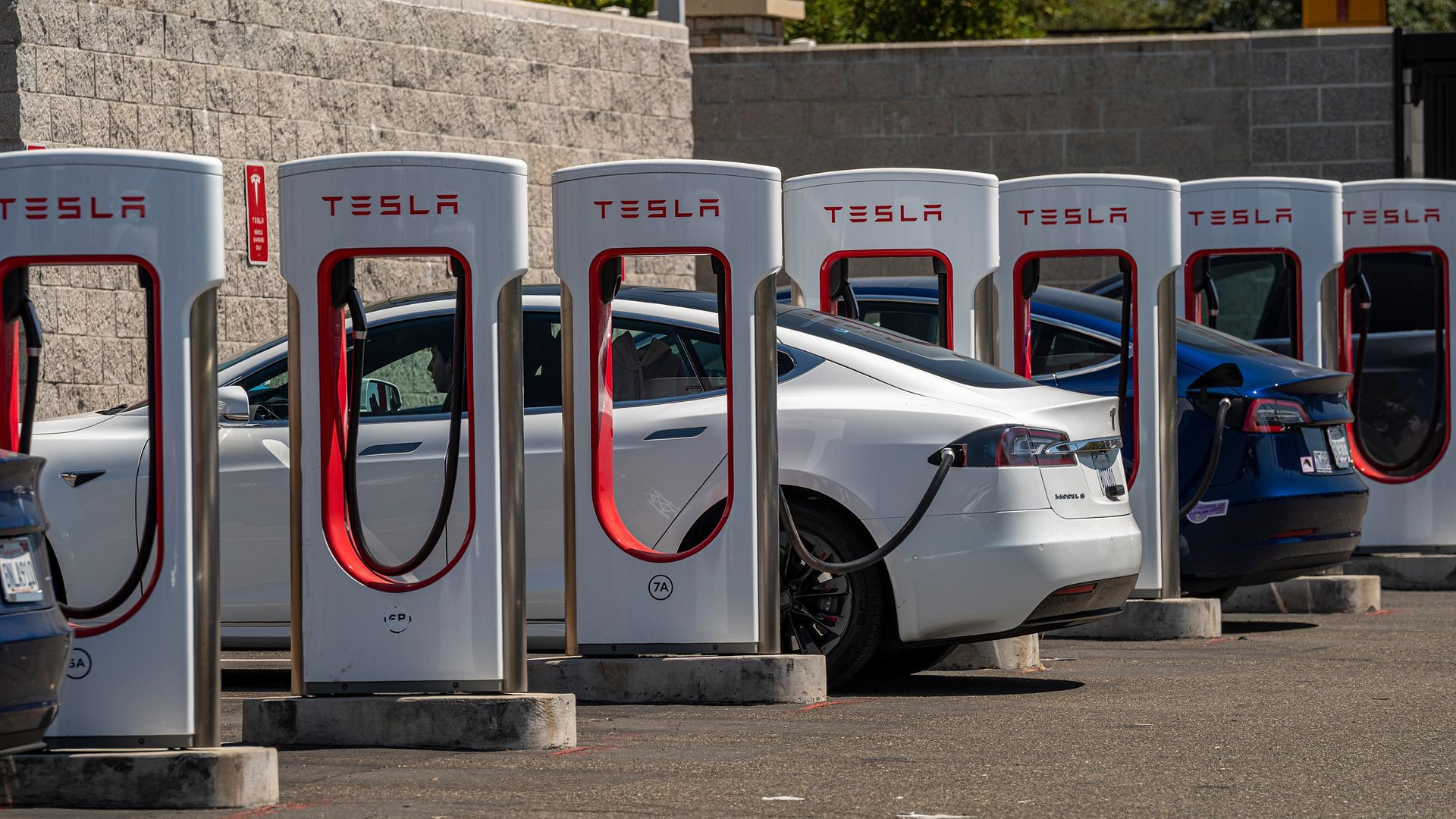 Tesla vehicles at charging stations outside a store in Rocklin, California