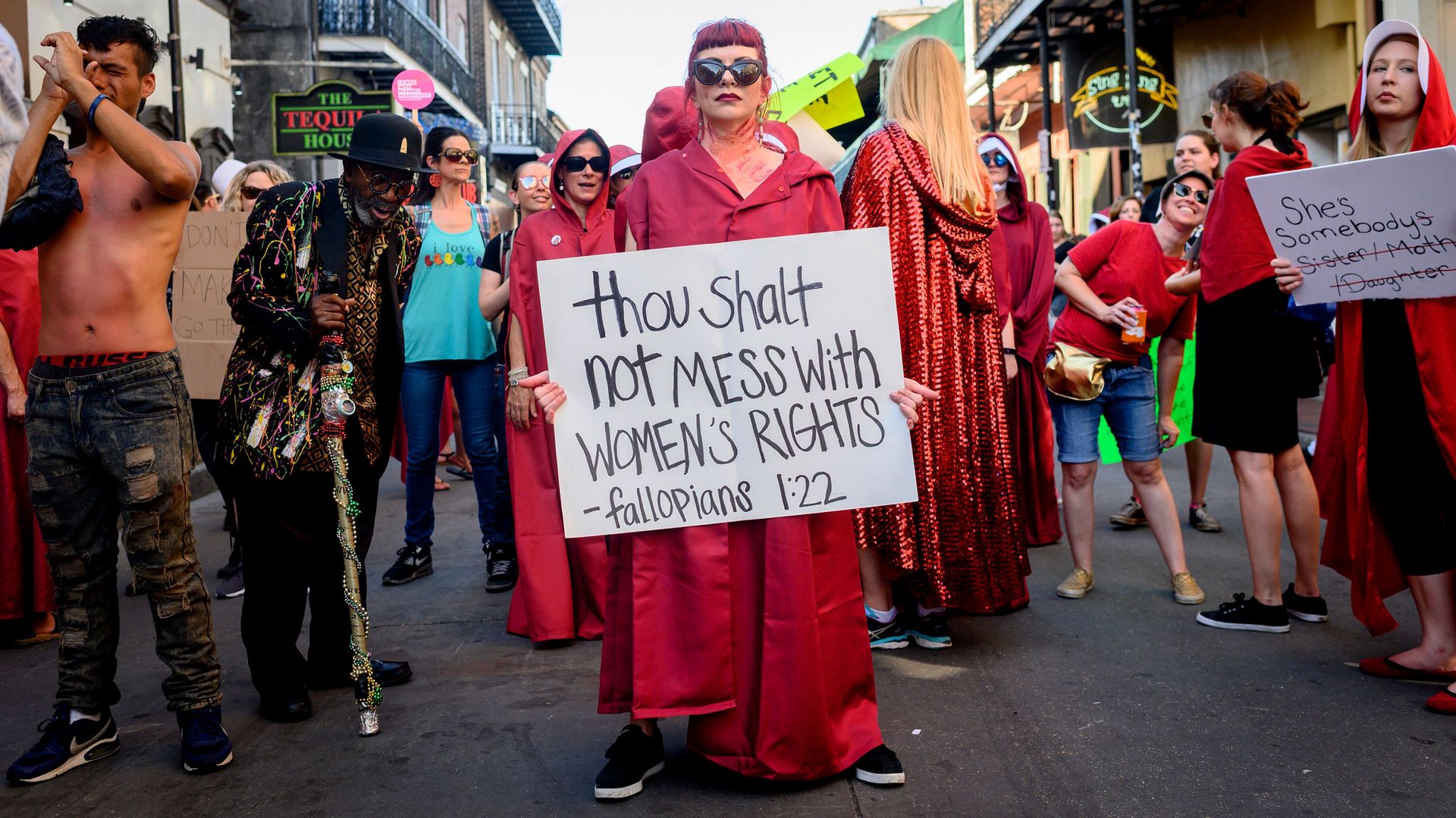 Picture of people protesting in favor of abortion access wearing red robes