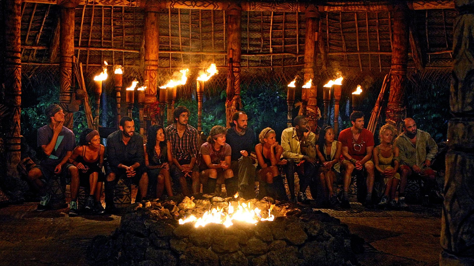 The Tribal Council, a group of people surrounded by a fire pit, on the show survivor.