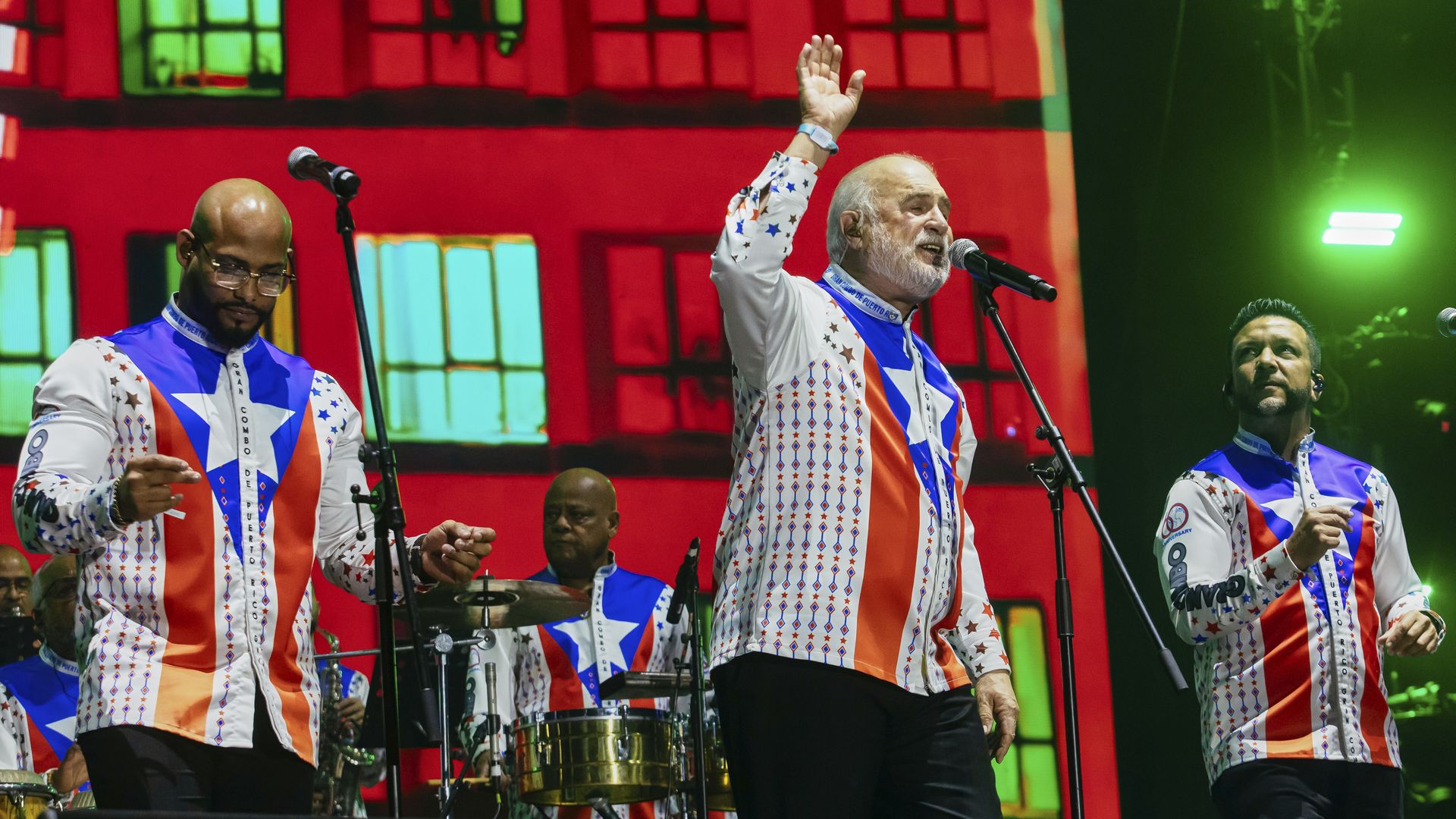 From left, Anthony García, Jerry Rivas and Virgil Rivera of the band El Gran Combo de Puerto Rico on stage as Rivas sings during Vive Latino 2026 at Foro GNP Seguros on March 14, 2026 in Mexico City, Mexico. 