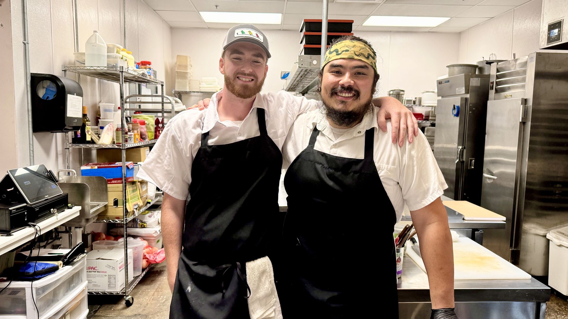 two chefs stand side by side