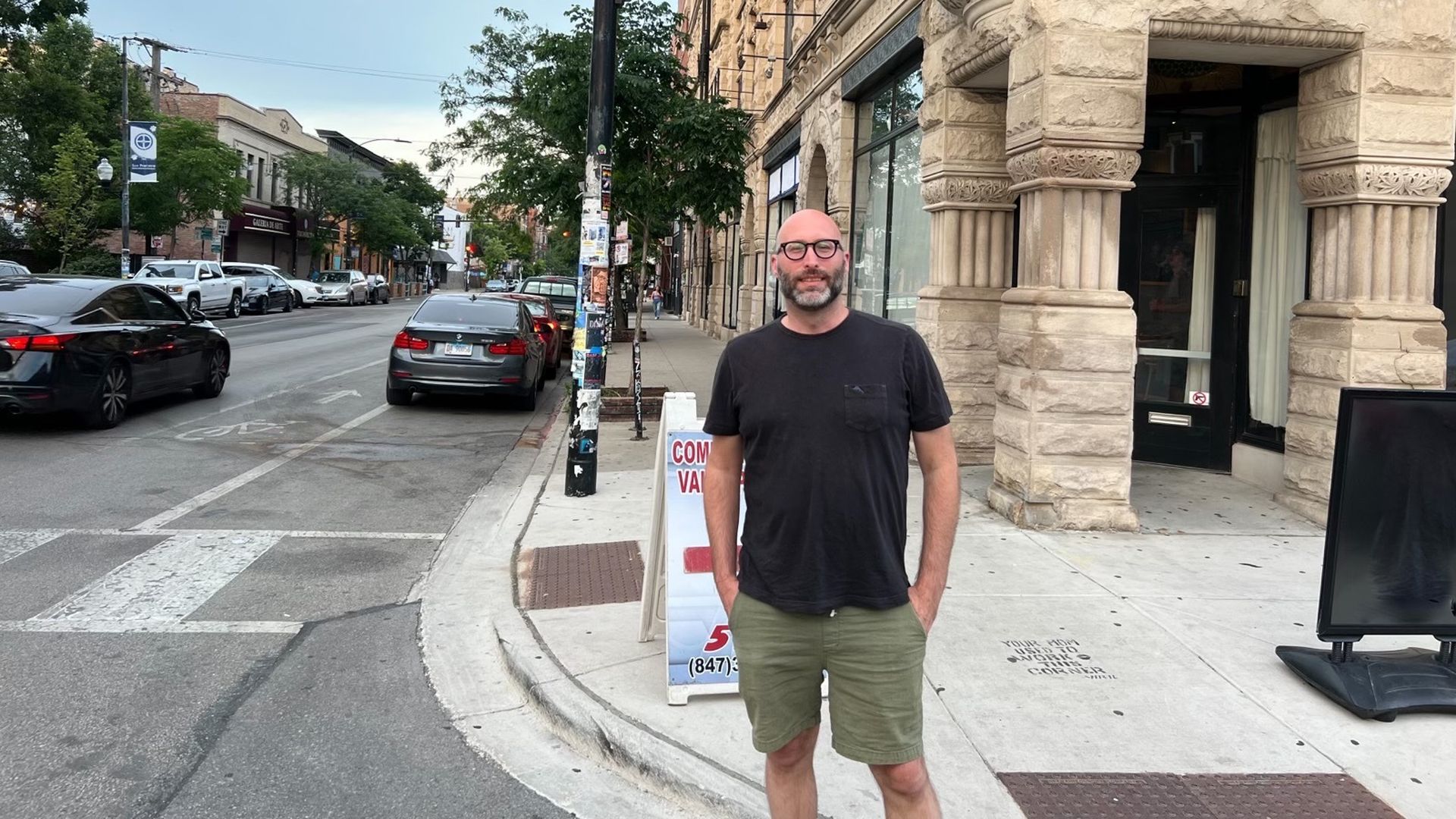 Photo of a man standing in the street 