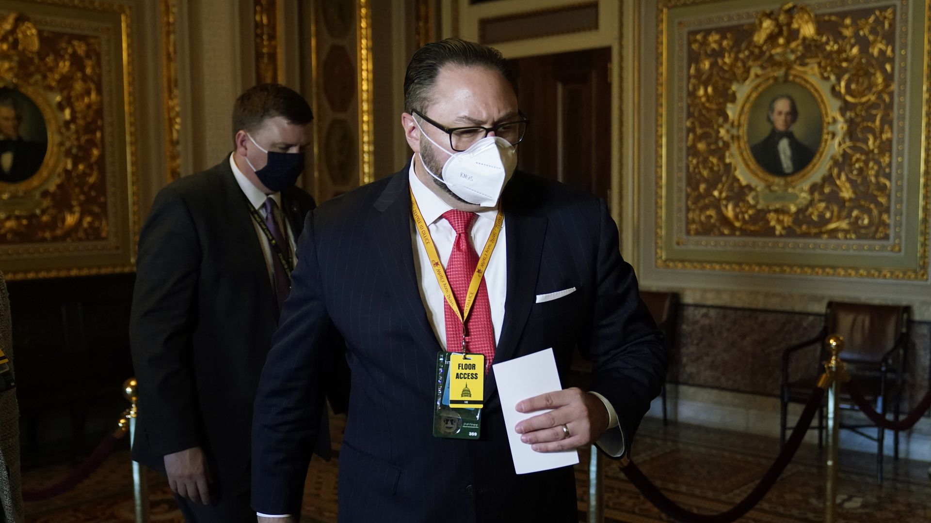 Jason Miller, Senior Adviser to the Trump 2020 re-election campaign, walks in on the first day of former President Donald Trump's second impeachment trial at the U.S. Capitol on February 9