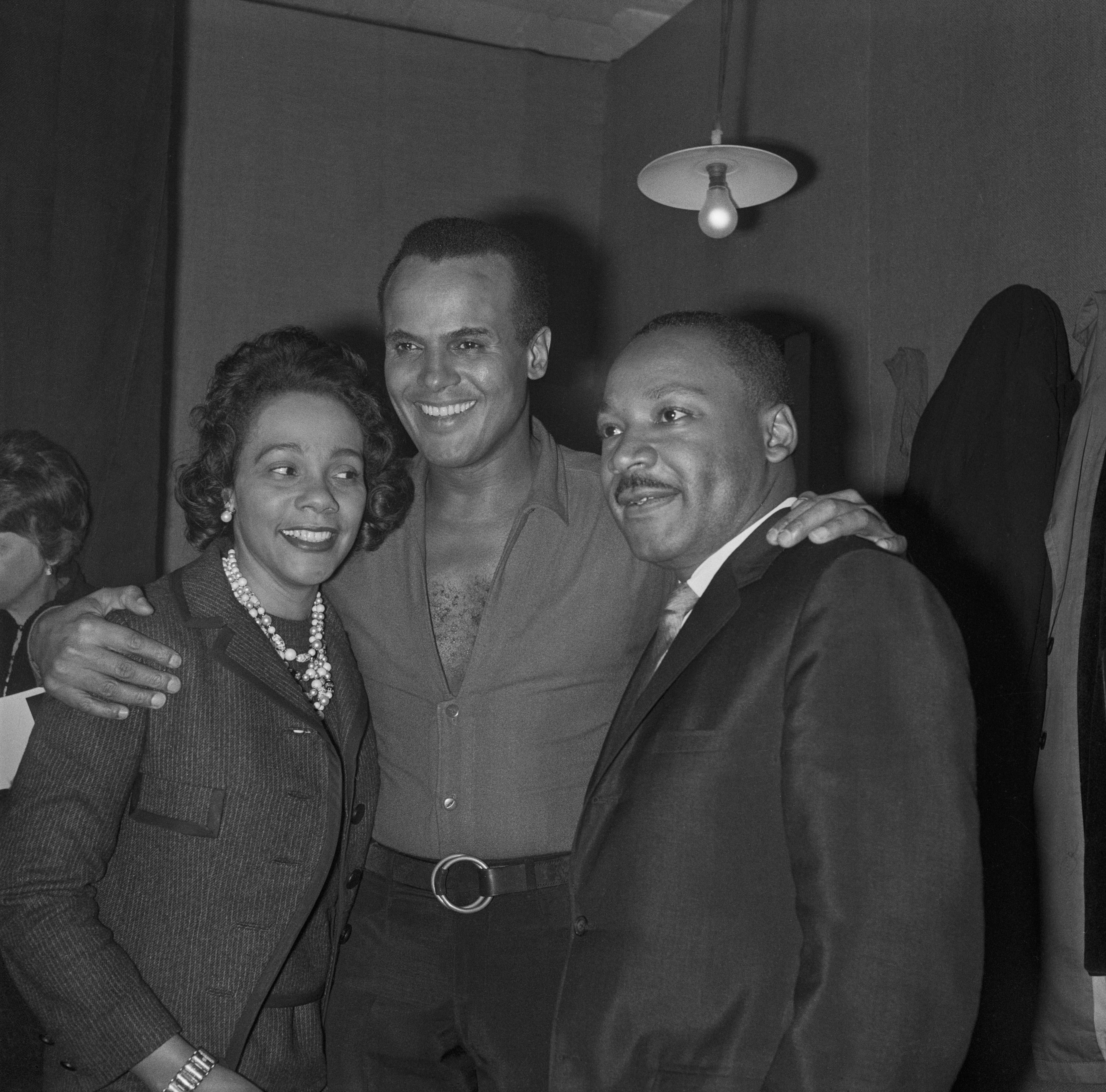 Harry Belafonte surrounded by Pastor Martin Luther King and his wife Coretta backstage at his concert at the Palais des Sports on March 28, 1966 in Paris, France. 