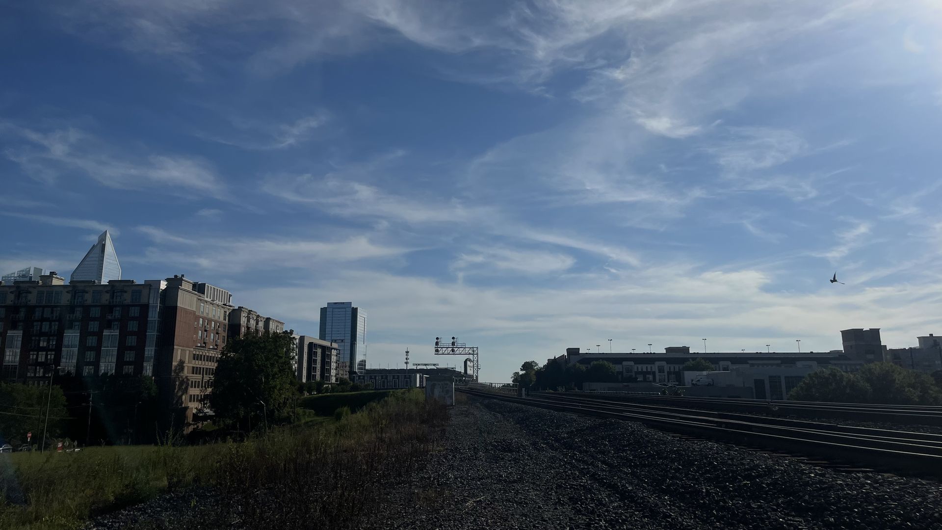 Train tracks with sunset in background