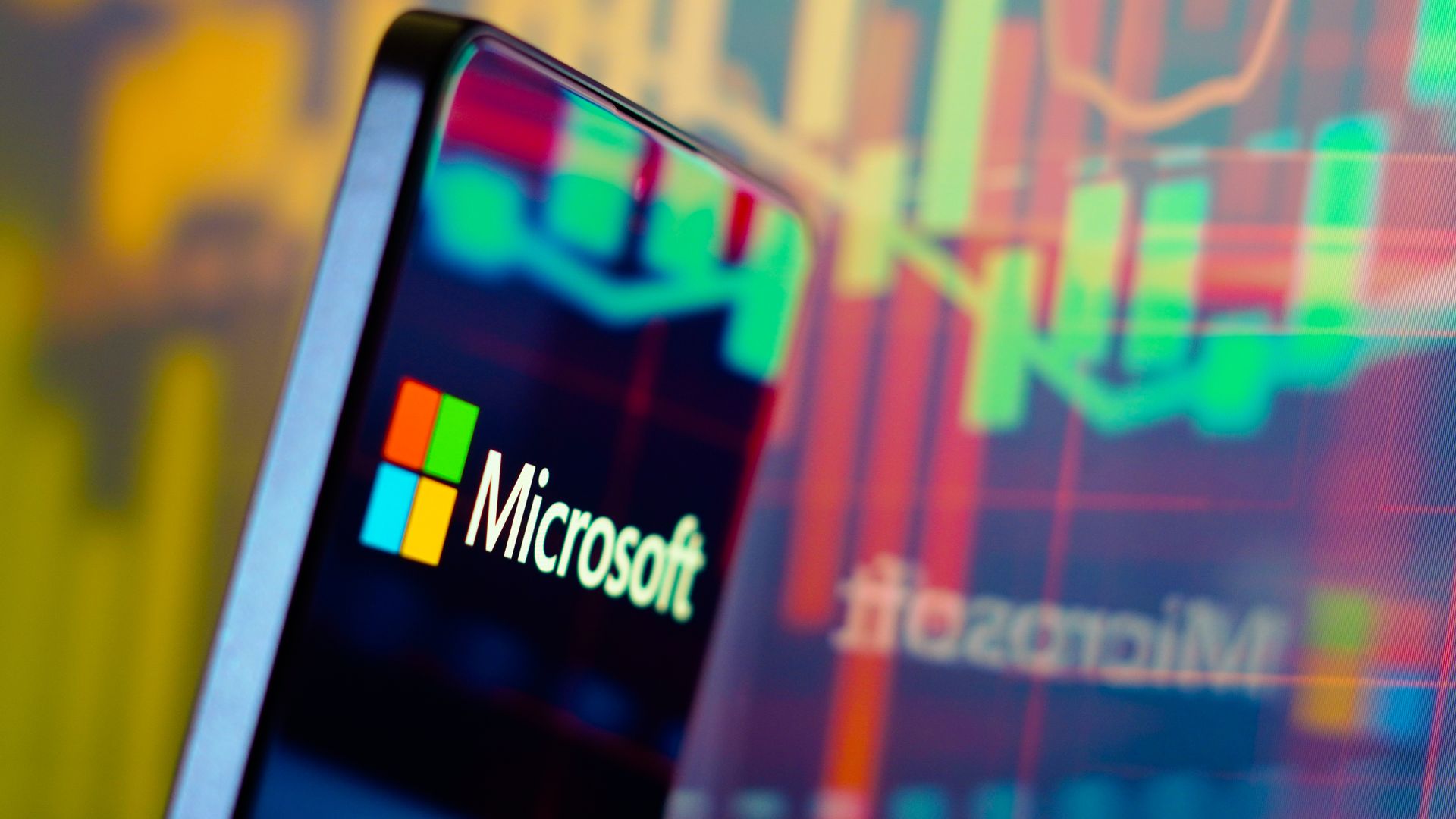 In this photo illustration, the Microsoft Corporation logo is displayed on a smartphone screen. 