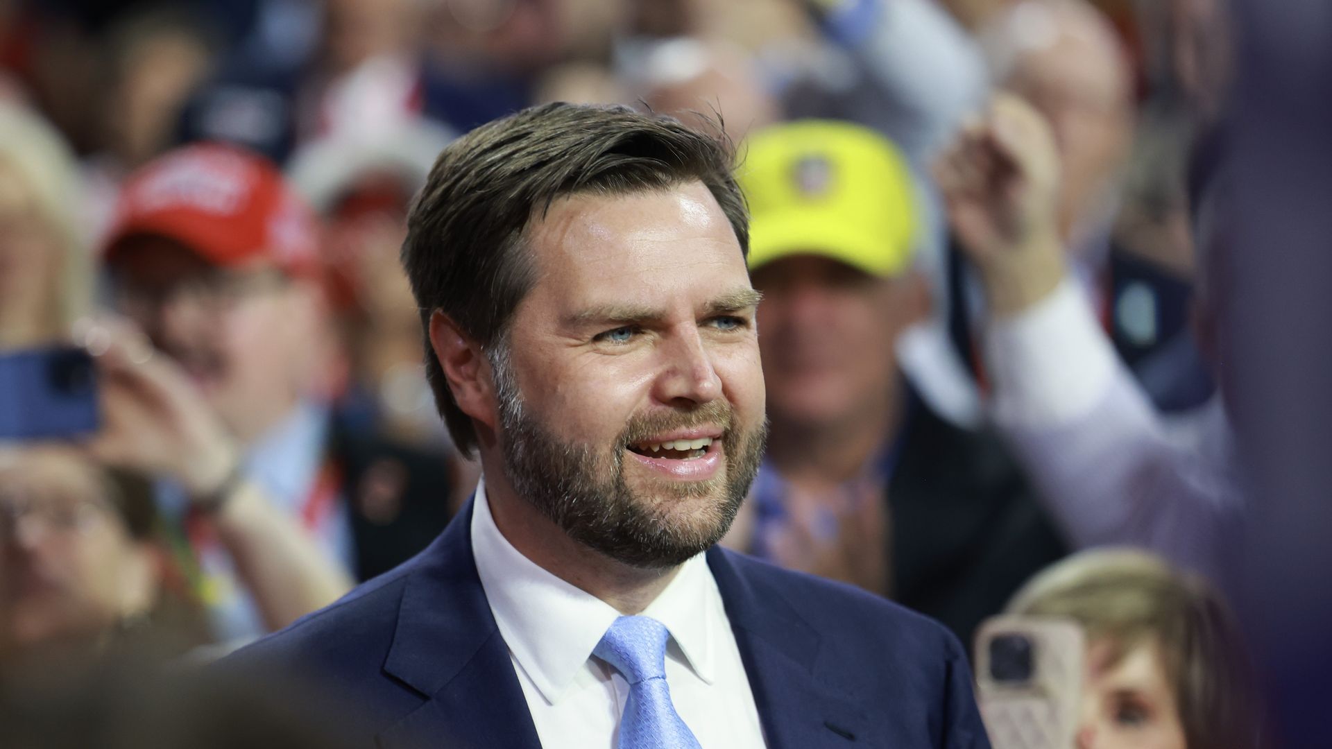 J.D. Vance in a blue suite, white shirt, light blue tie