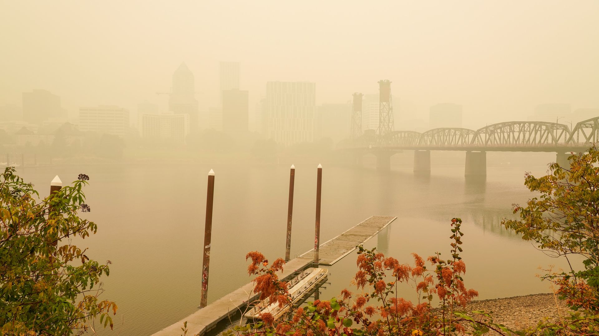A photo of downtown Portland from the Central Eastside, the sky thick with hazy wildfire smoke. 