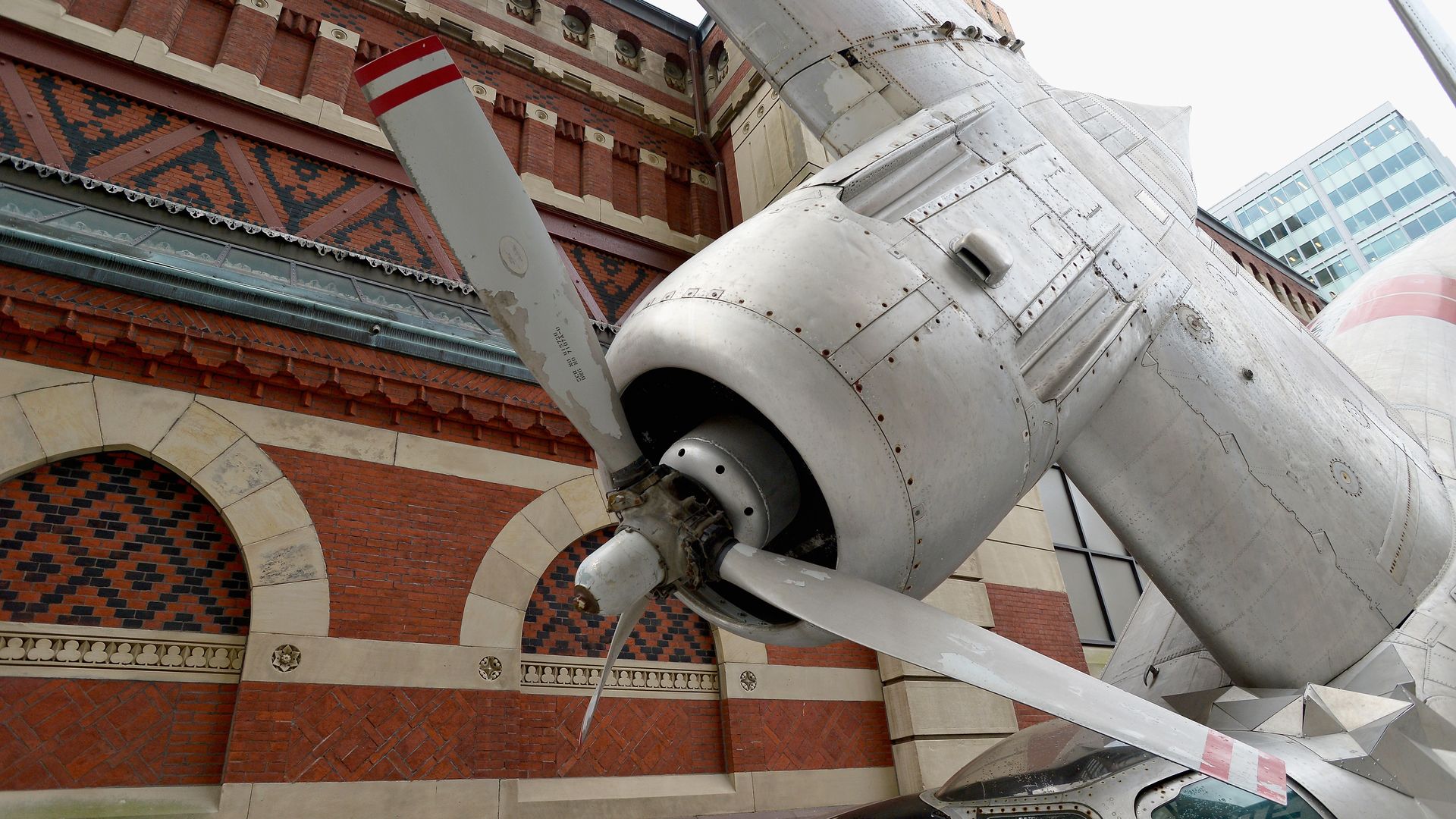 A photo of the scrap metal wing and propeller of "The Grumman Greenhouse."