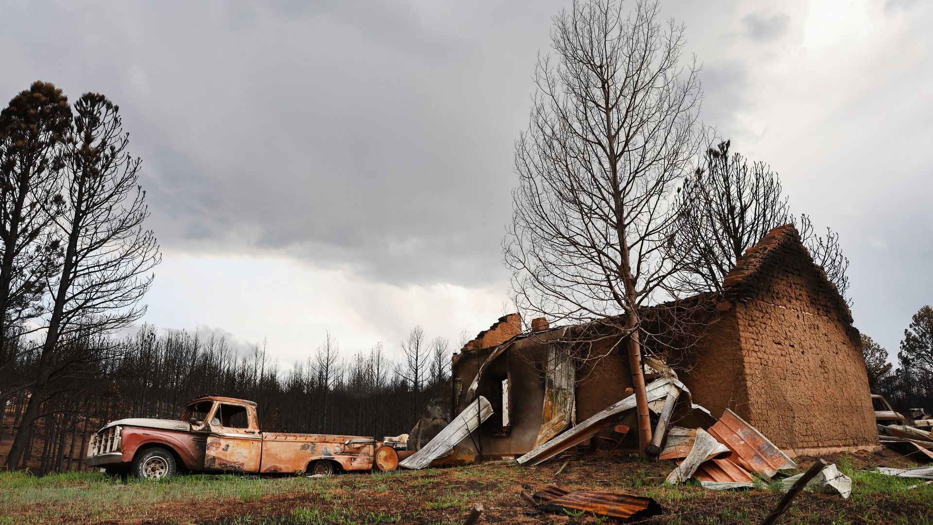 A scorched structure and vehicle stand on a property mostly destroyed by the Hermits Peak/Calf Canyon Fire on June 2, 2022 near Las Vegas, New Mexico. The fire has burned for two months and scorched over 315,000 acres while destroying more than 350 homes and other structures.