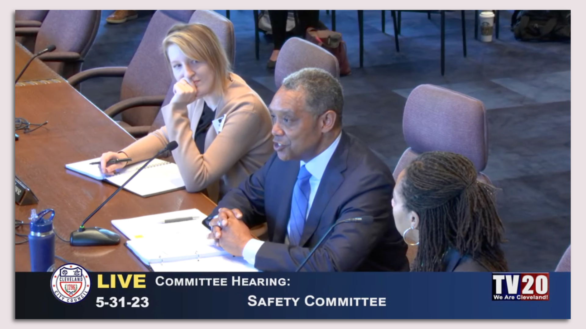 A screenshot of a live stream of a Cleveland City Council safety committee meeting, with a suited Karl Racine speaking