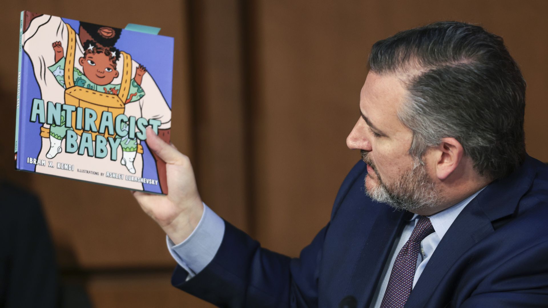 Sen. Ted Cruz is seen holding a book titled, 