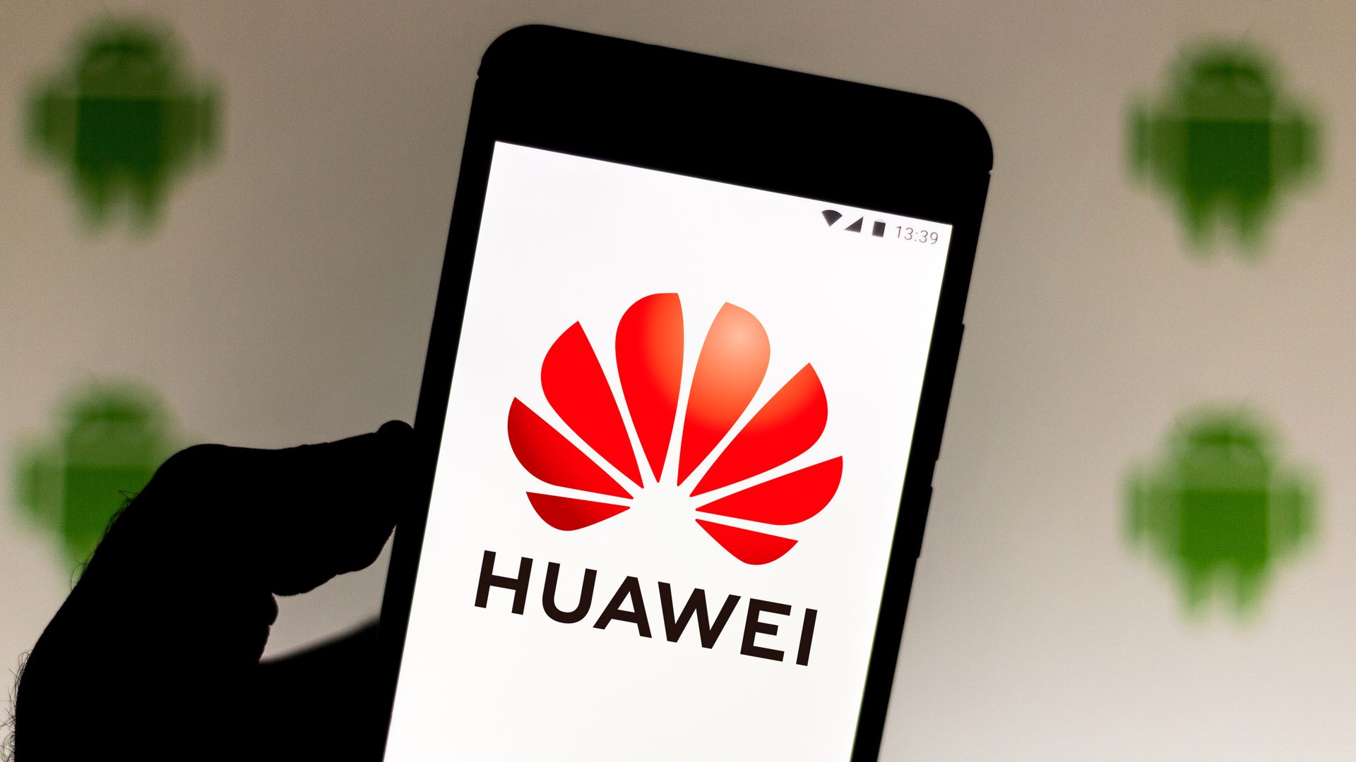 The Huawei logo on a phone.