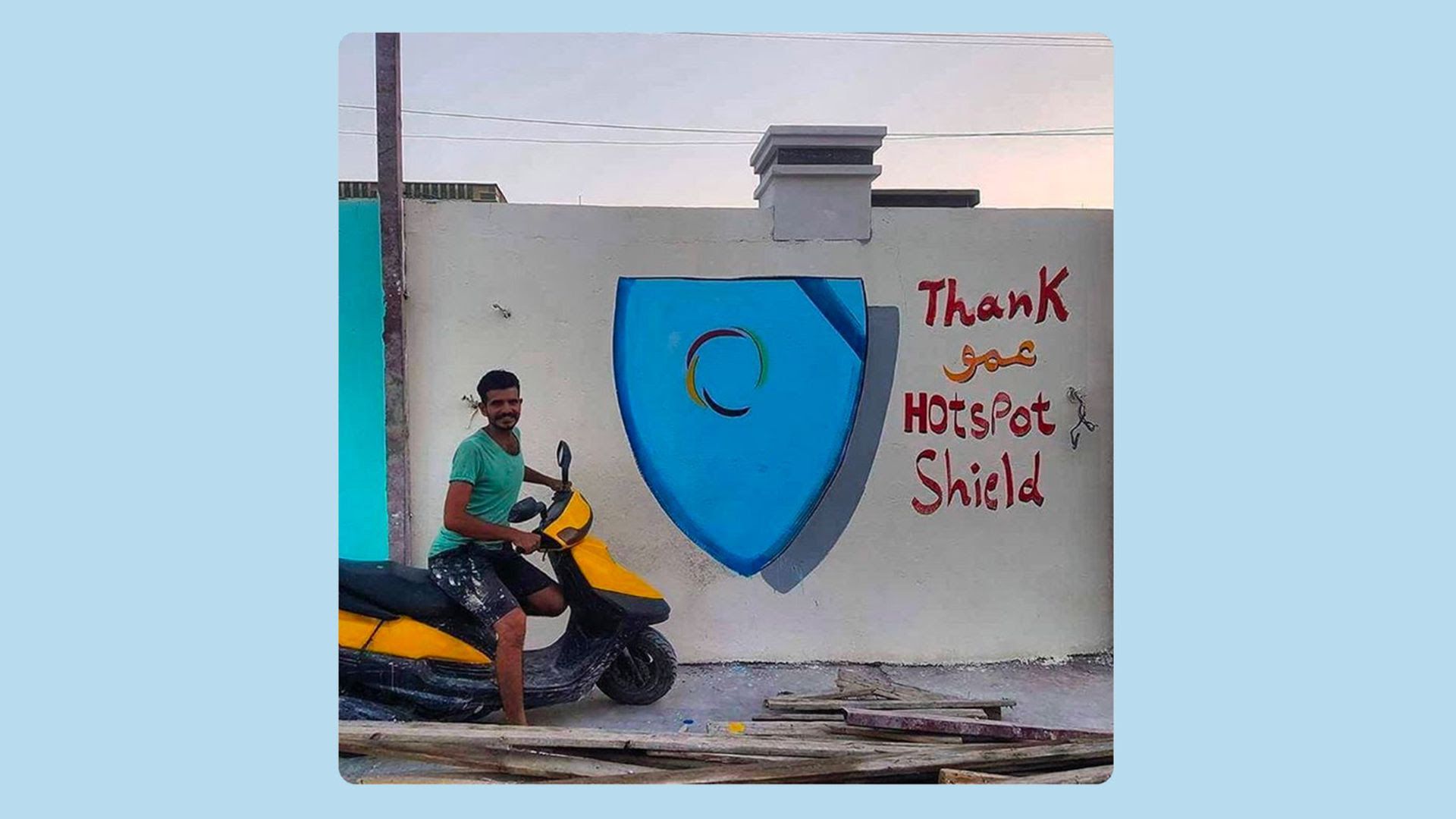 Man on motorbike next to graffiti saying Thank you HotspotShield