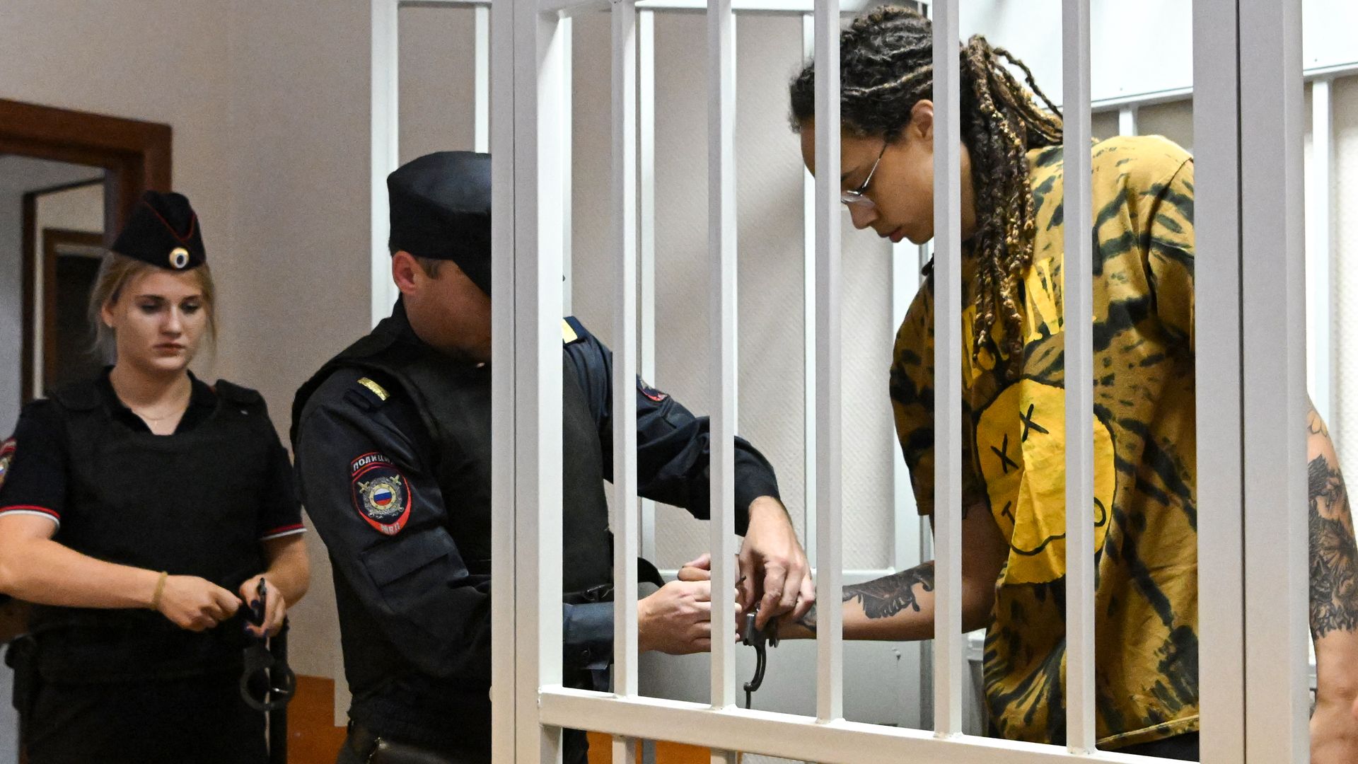 US WNBA basketball superstar Brittney Griner gets handcuffs taken off before a hearing at the Khimki Court in the town of Khimki.