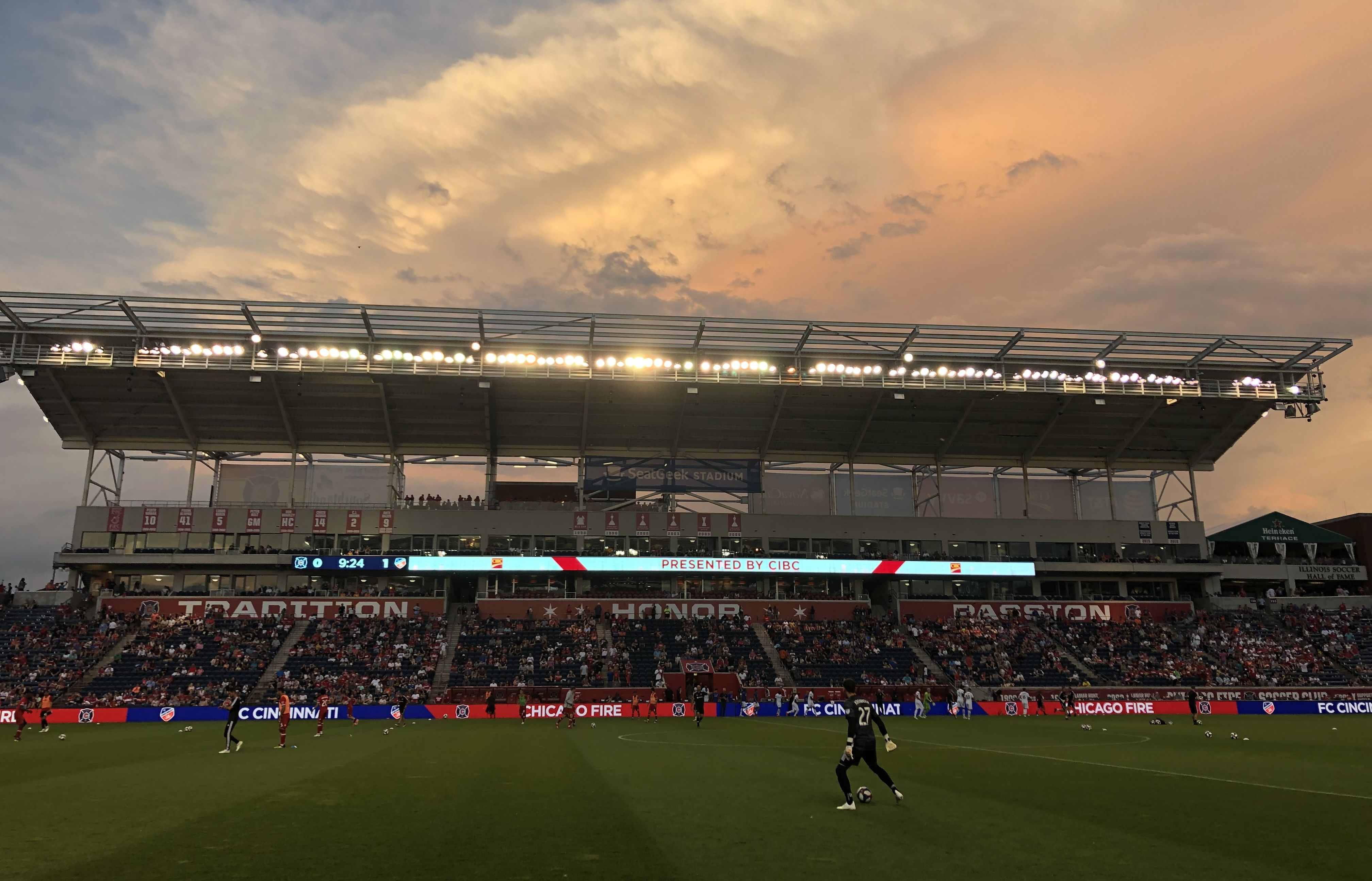 Soccer field and stadium with a player on field