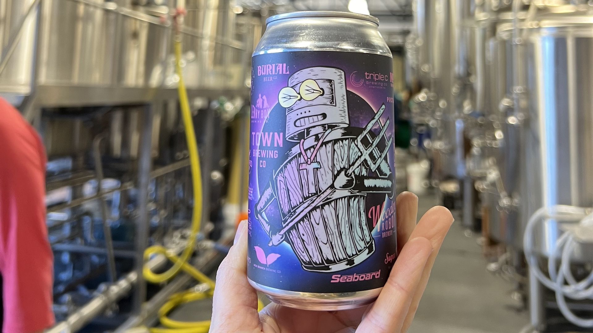 hand holding can of beer