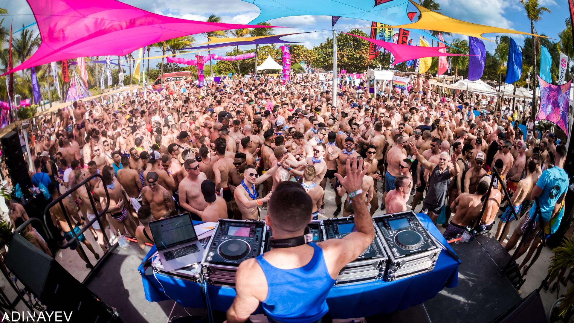 A DJ plays music for a large crowd at Winter Party Festival in 2020.