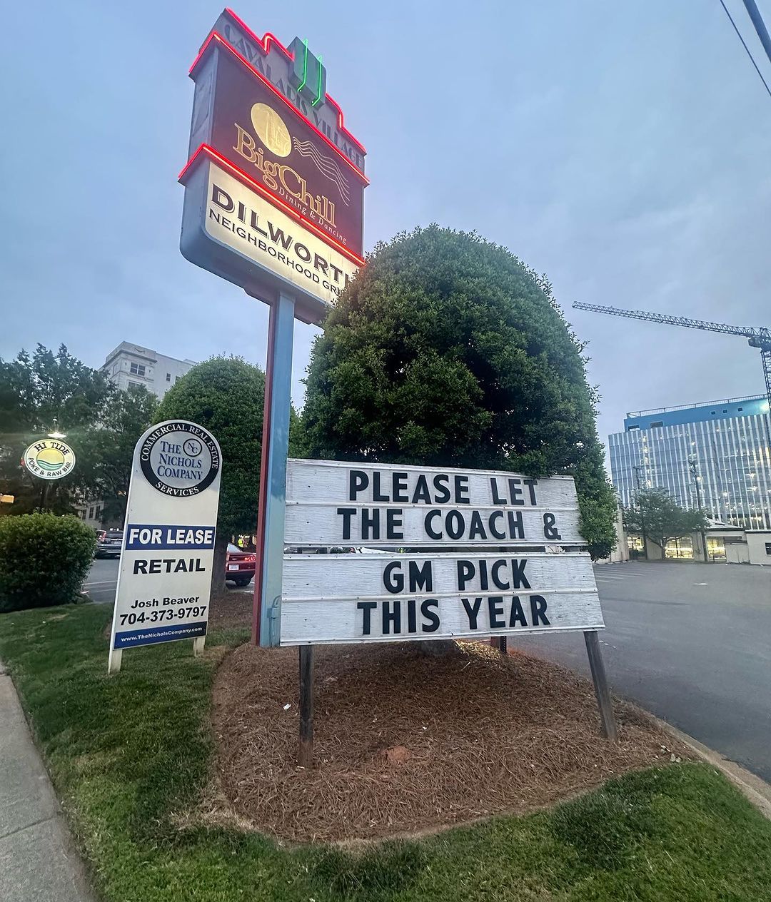 "Please let the coach & GM pick this year" sign outside Dilworth Neighborhood Grille.