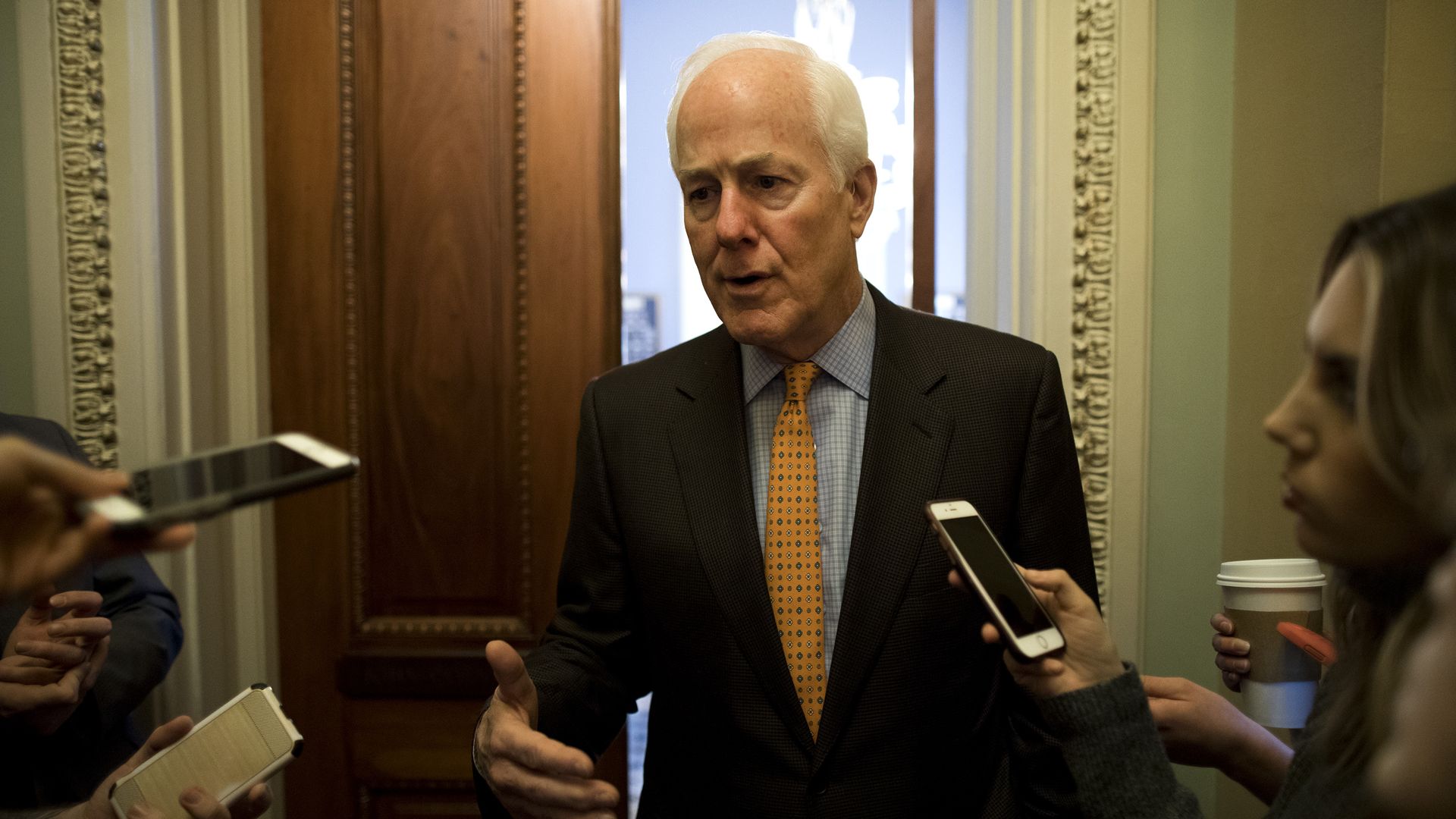John Cornyn talks to reporters