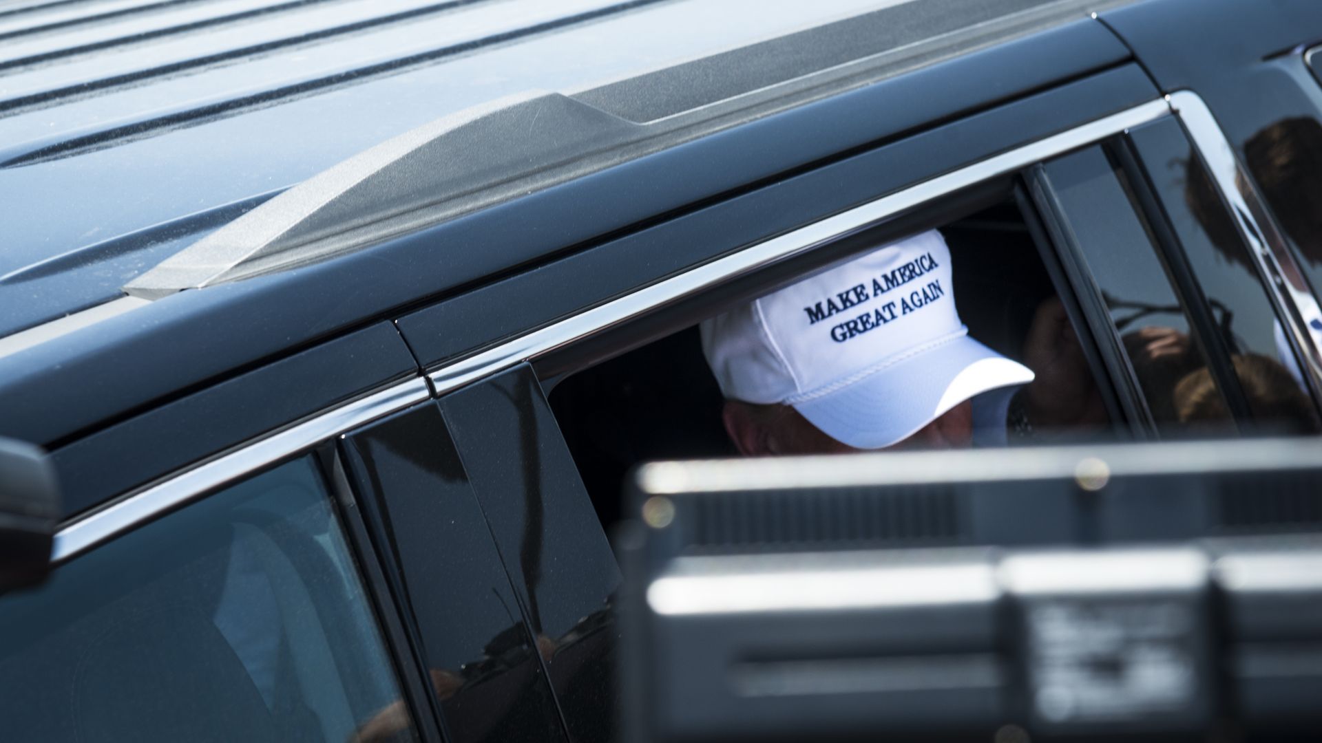President Trump stepping out of a car