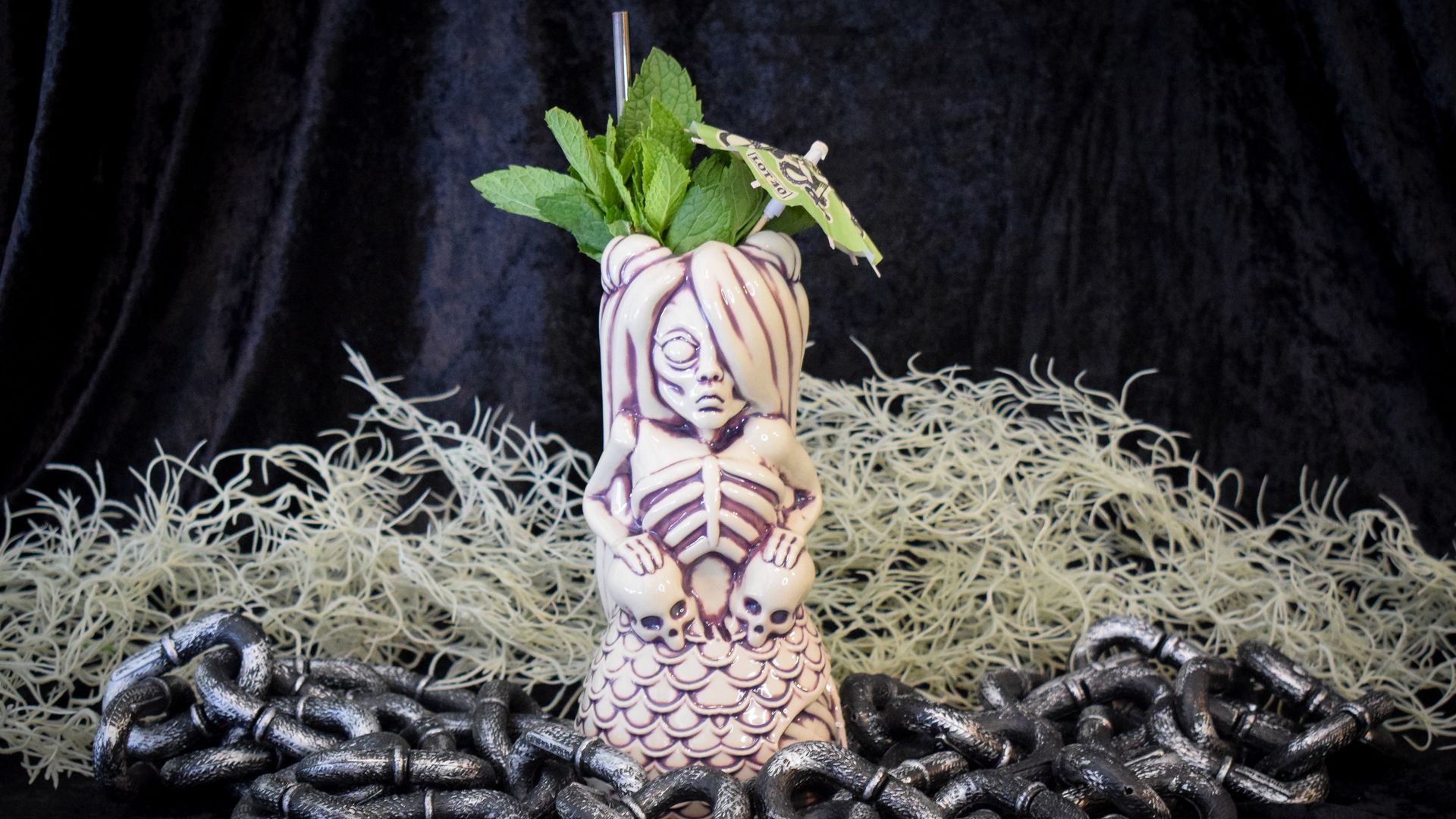 Zombie cocktail glass with mint