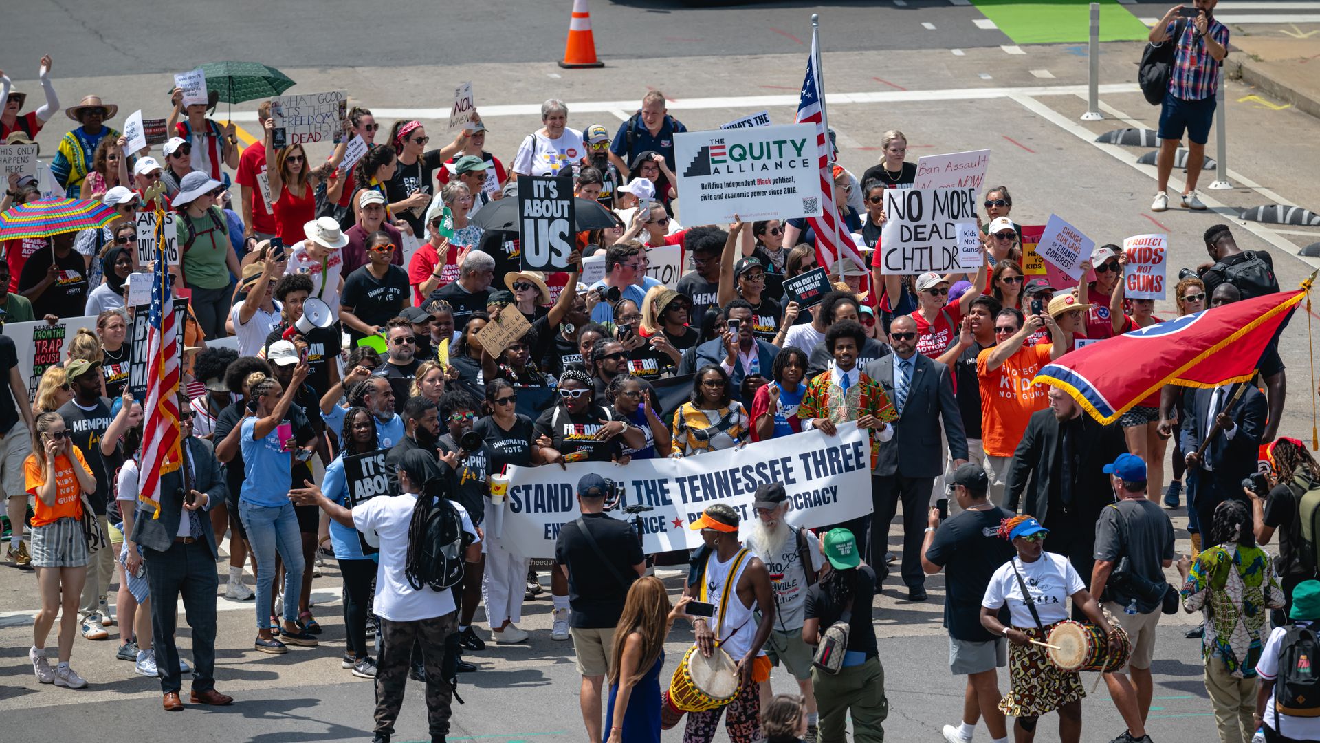 Gun reform activists march toward the capitol ahead of the special session on August 21, 2023