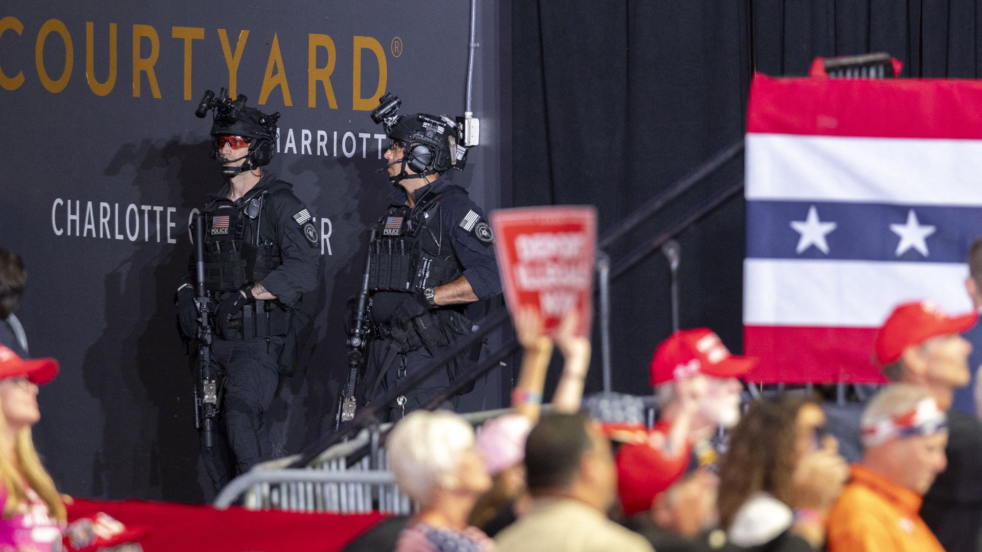 Secret Service officers post near an exit at a Trump rally