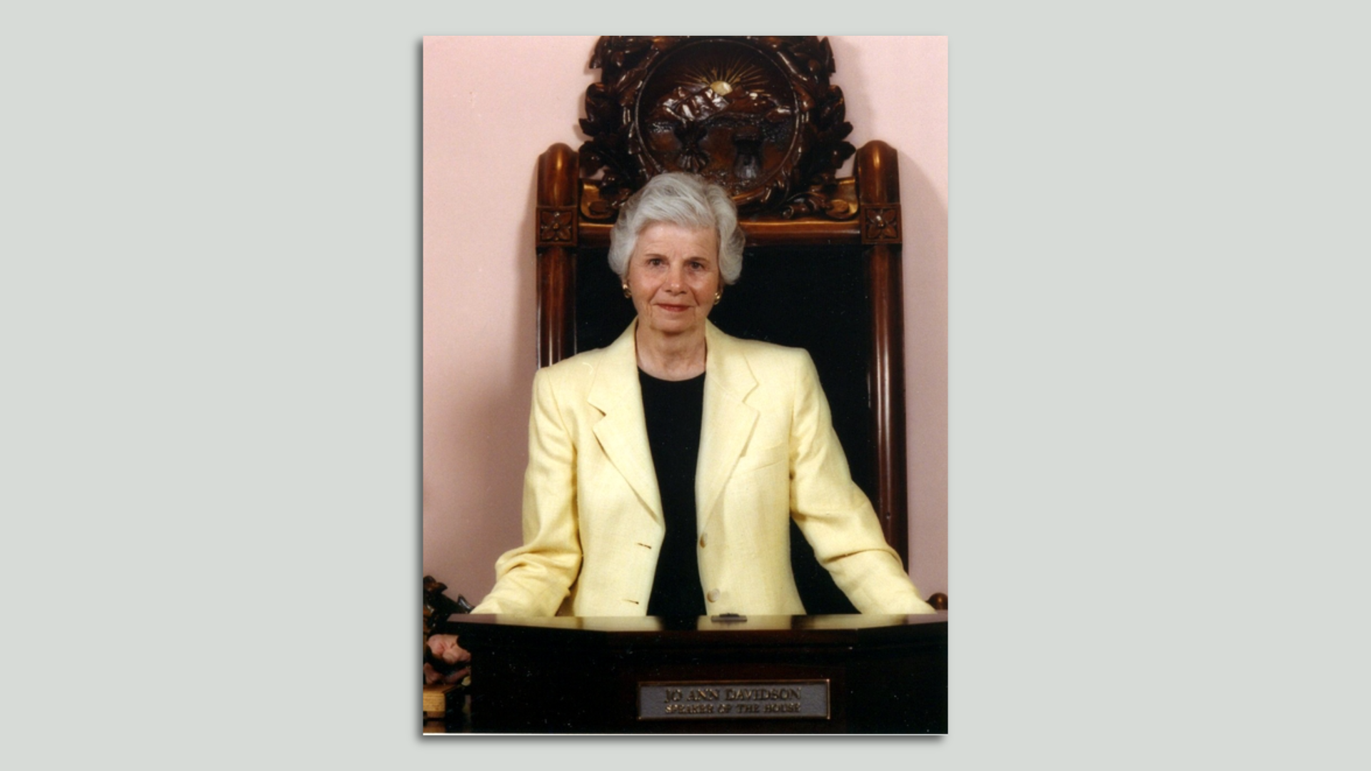 Former Ohio House Speaker Jo Ann Davidson stands at the speaker's desk in a historic photo.
