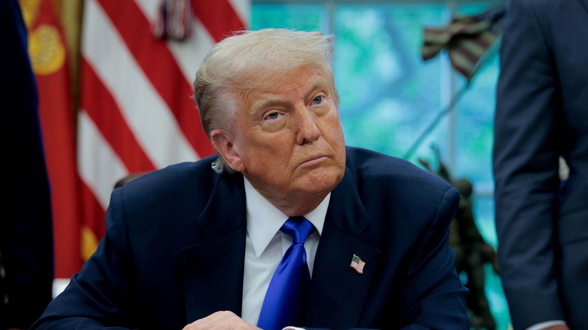 President Trump in the Oval Office taking questions from reporters. 