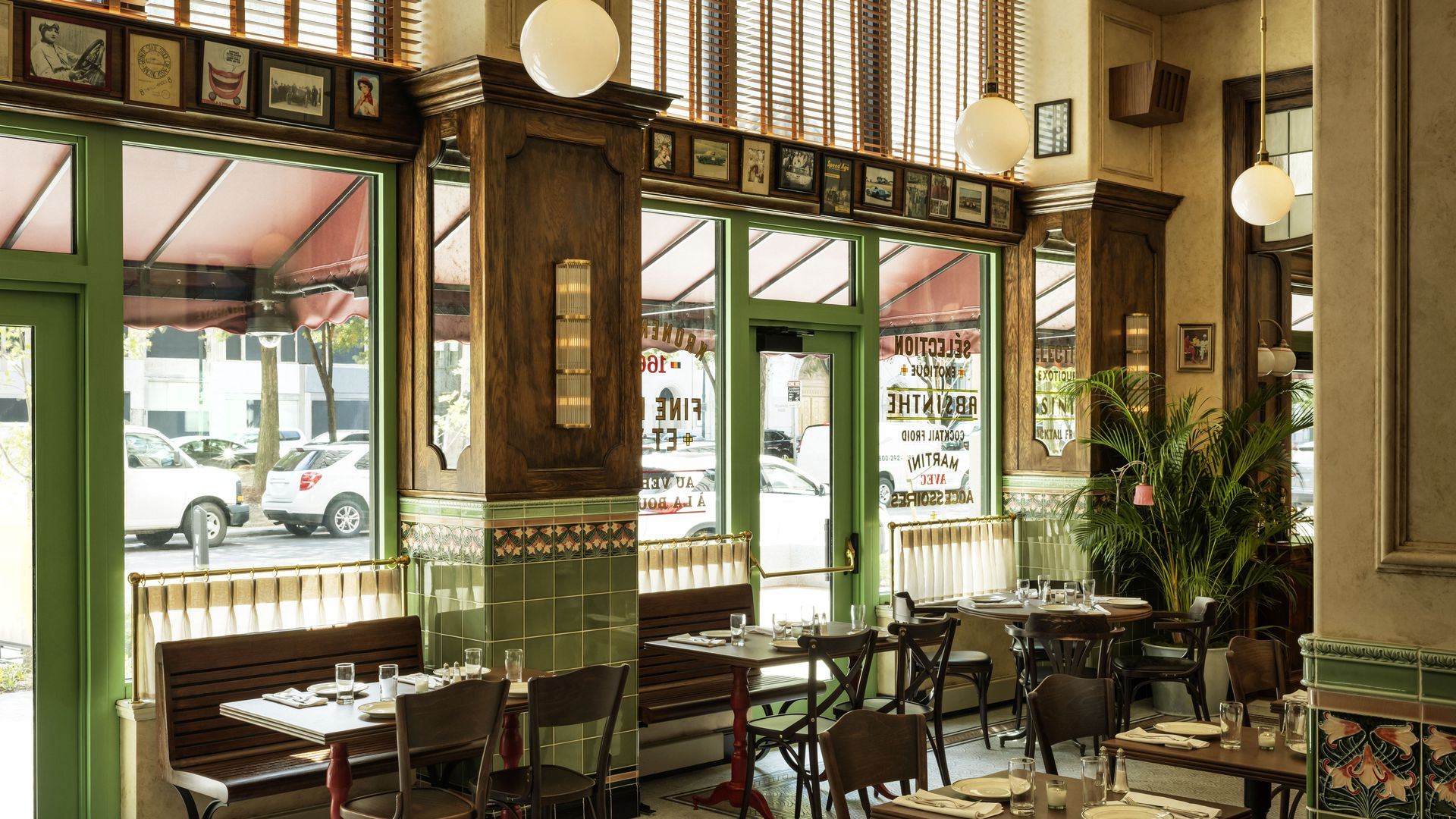 The interior of the restaurant, with wooden chairs and old-style finishes. Doorframes are a lime green.