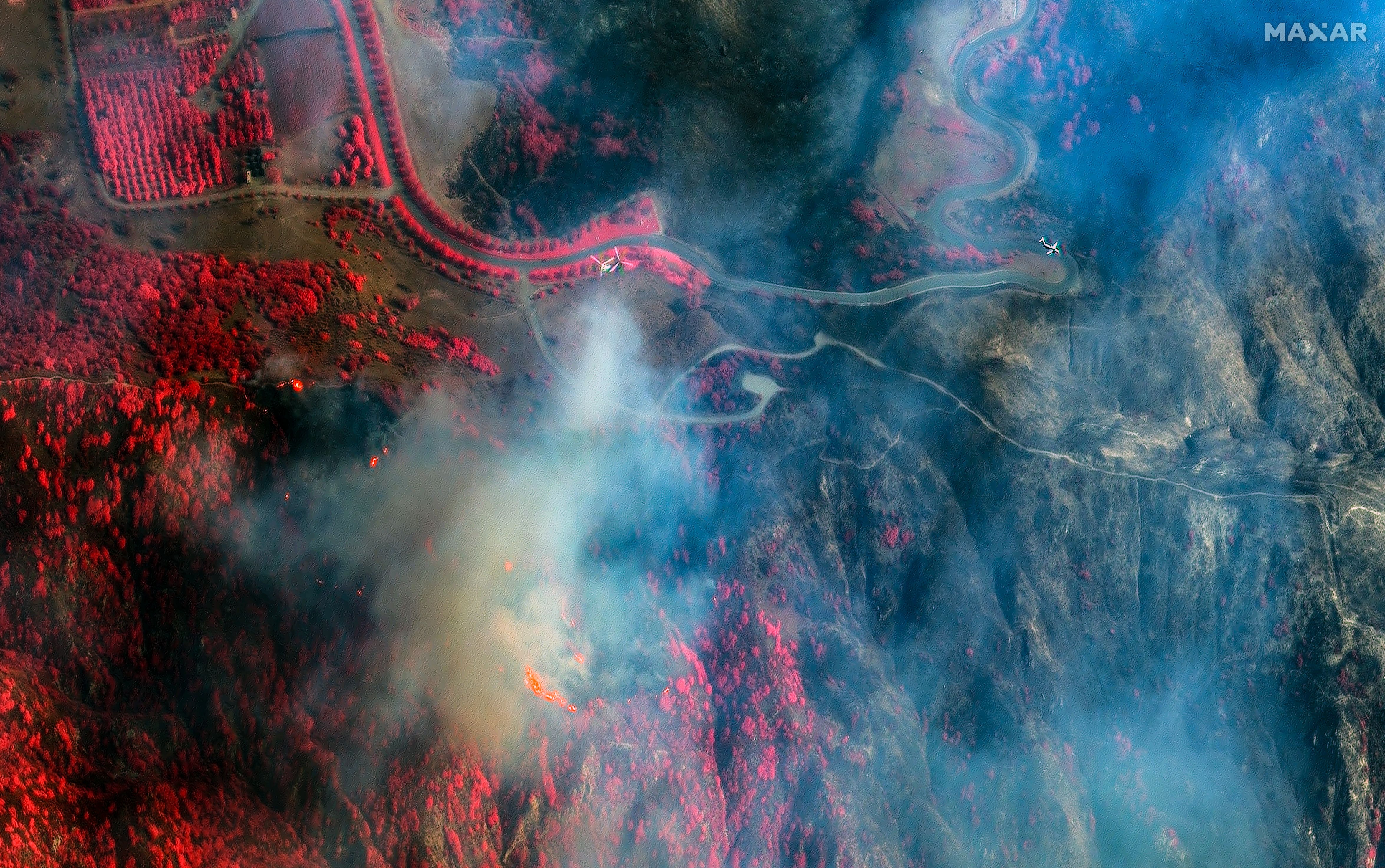 Image 06 in the gallery (see link below) uses our color infrared multispectral imagery which helps to distinguish between burned vegetation (which appears in shades of gray) and non-burned areas (which appear in shades of red/pink).