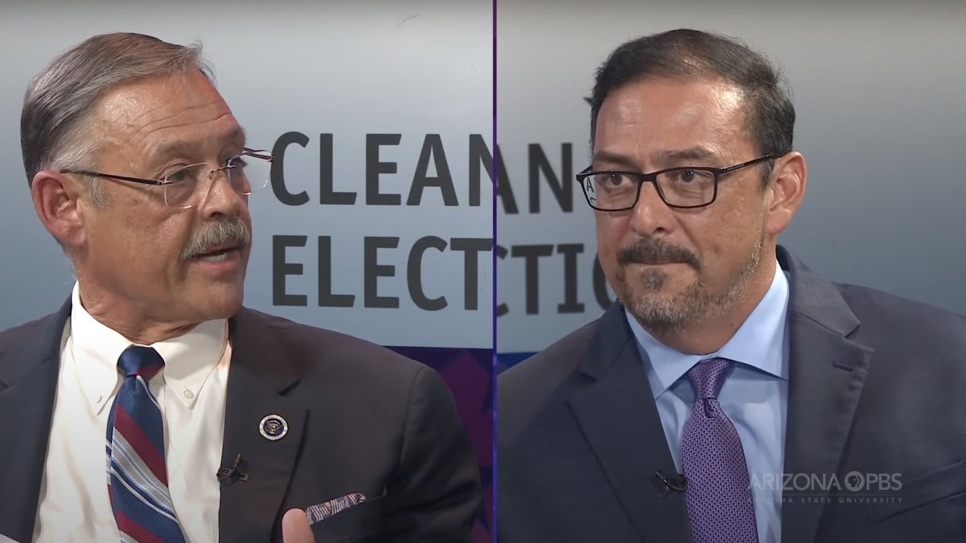 A screenshot of Mark Finchem and Adrian Fontes debating