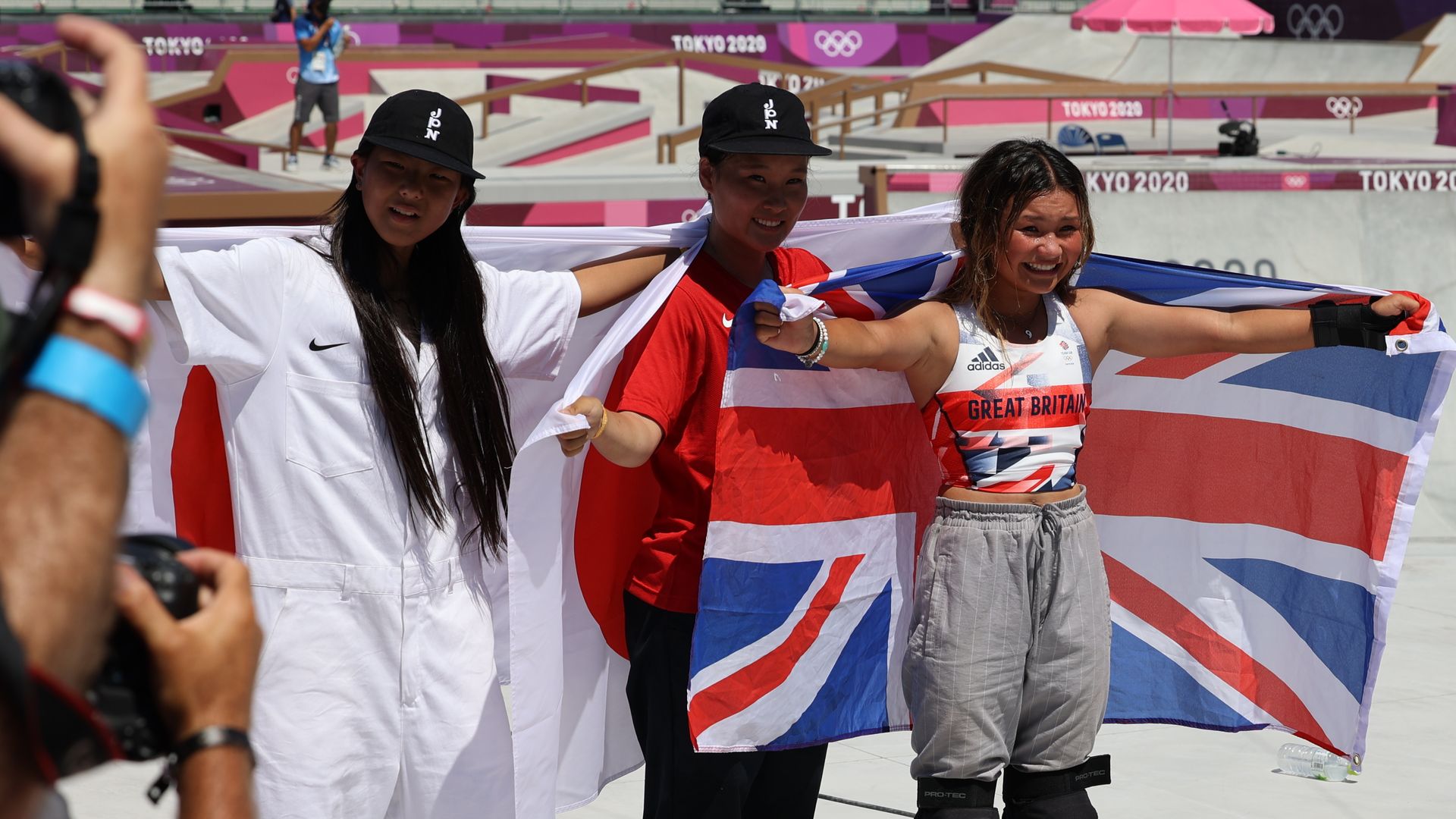 The Olympic skateboarding contest winners pose with their national flags